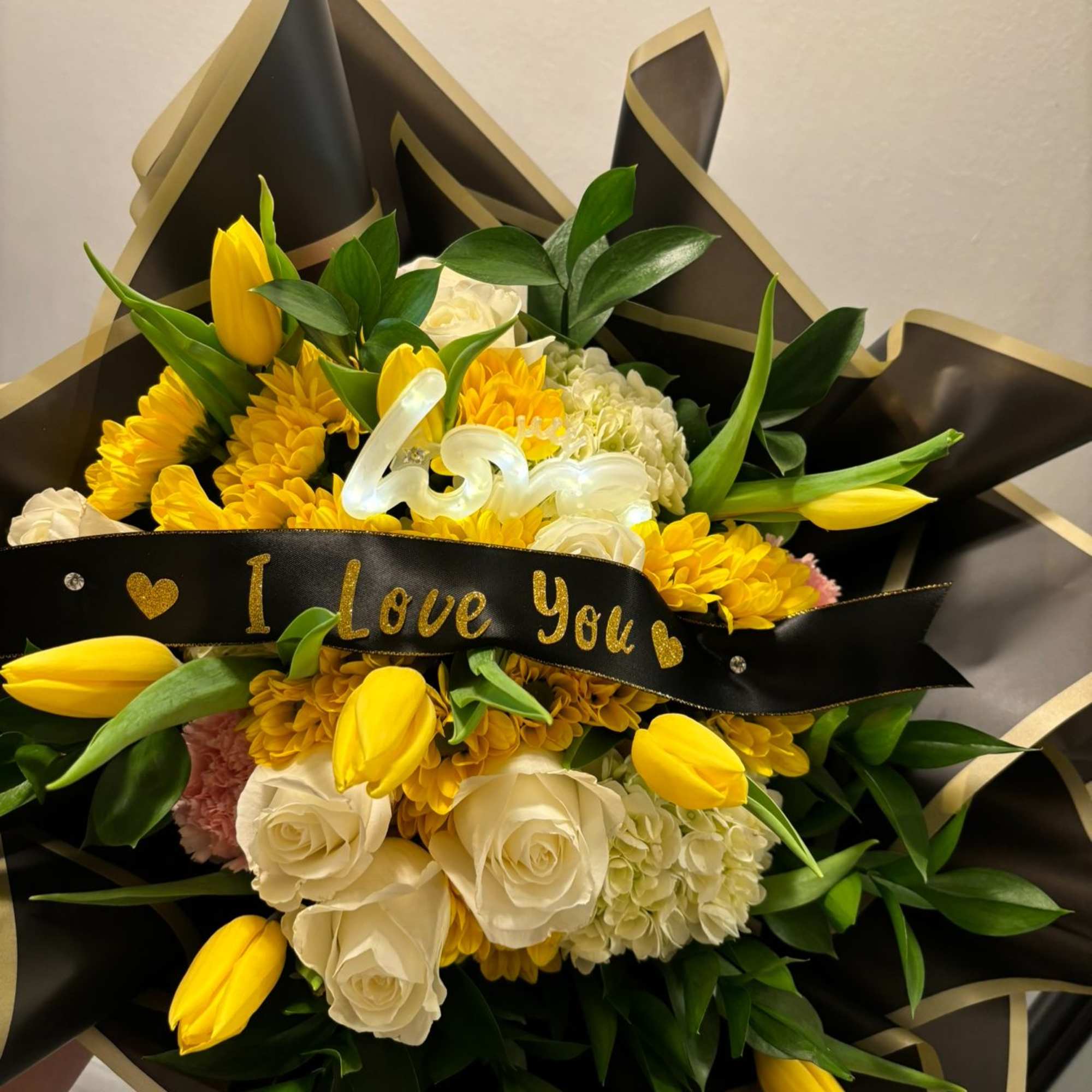 A beautifully handcrafted bouquet featuring a curated selection of fresh, mixed flowers., photo 2 of 3