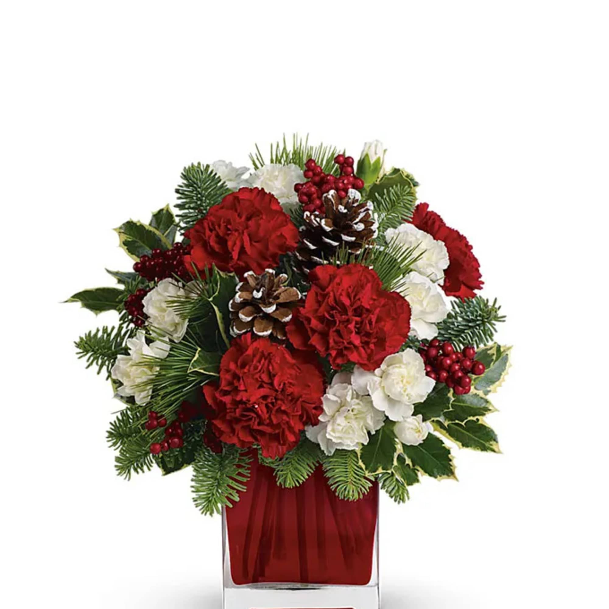 Red and white floral arrangement in a clear square vase