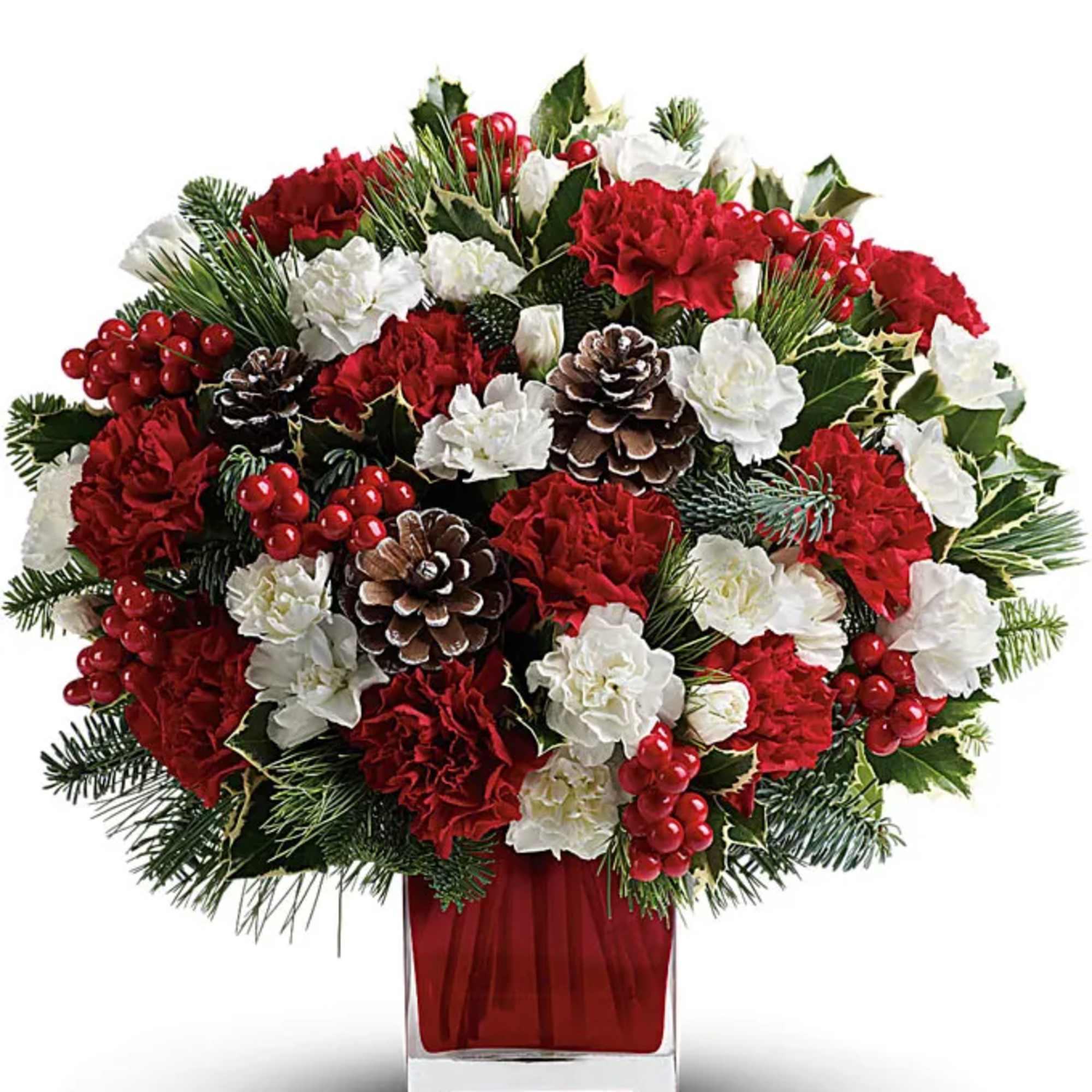 Red and white floral arrangement in a clear square vase
