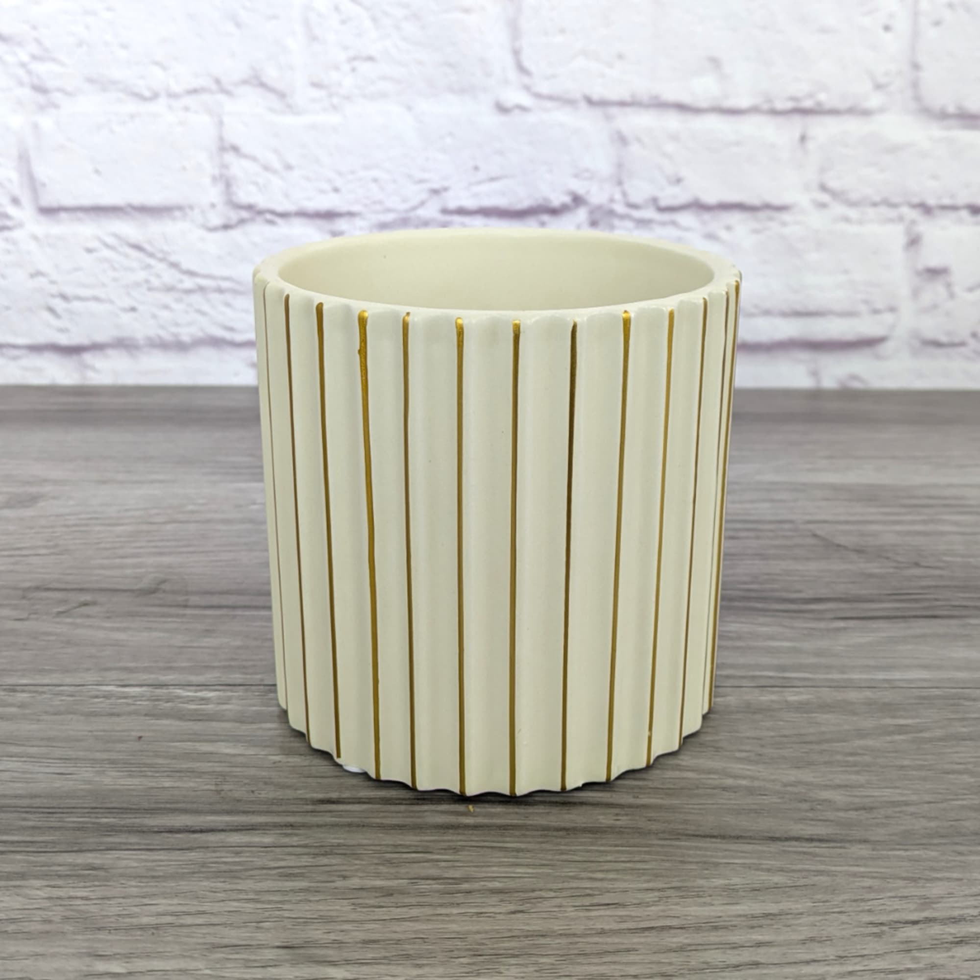 Cream ribbed ceramic planter with gold vertical accents
