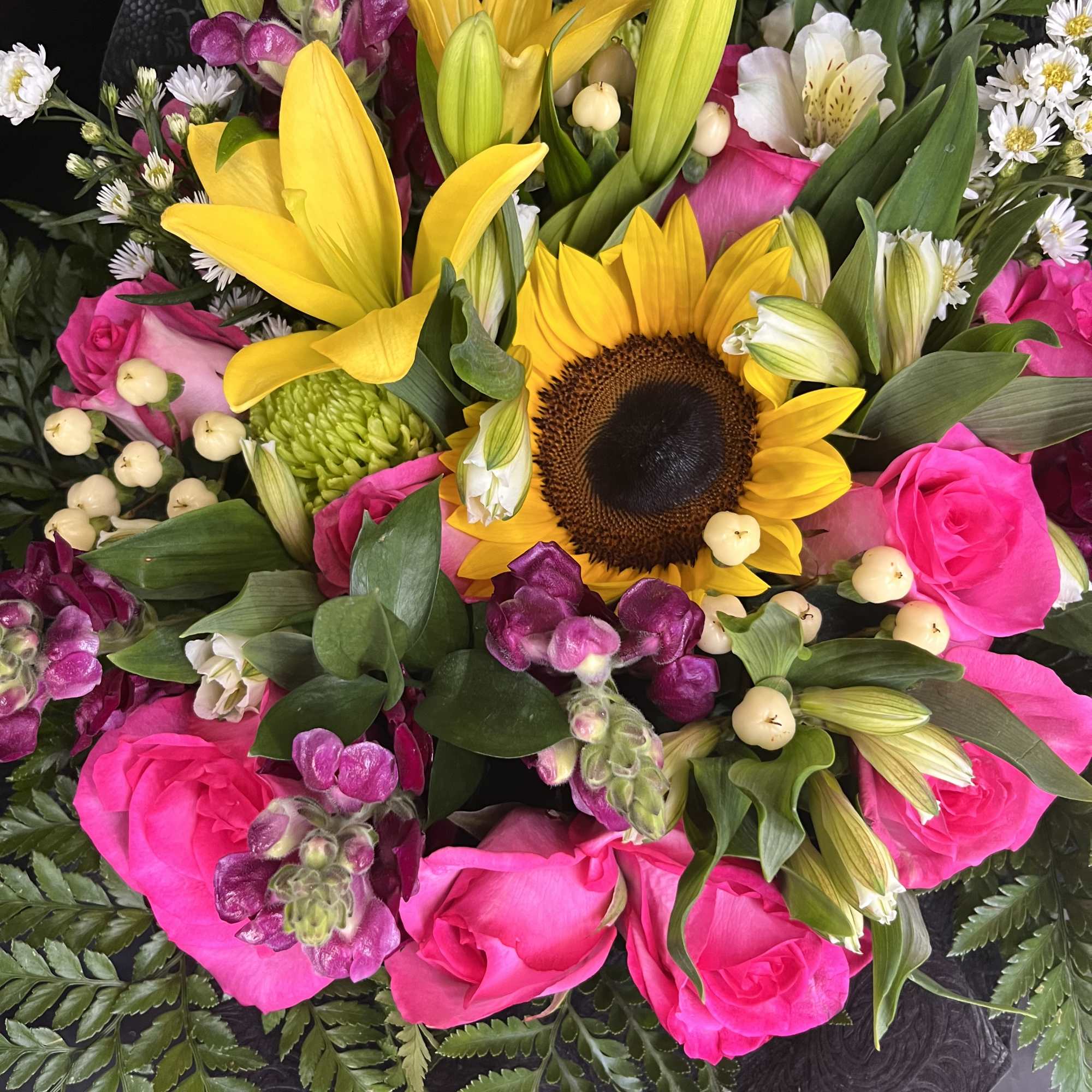 bouquet roses, sunflowers.and lilies