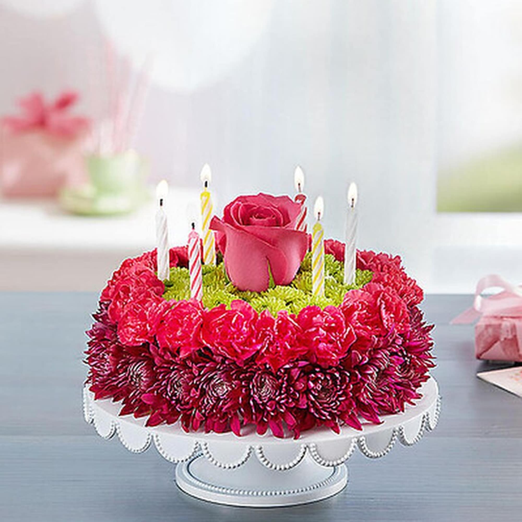 Purple adds a happy pop with this Birthday Wishes Flower Cake. Handcrafted