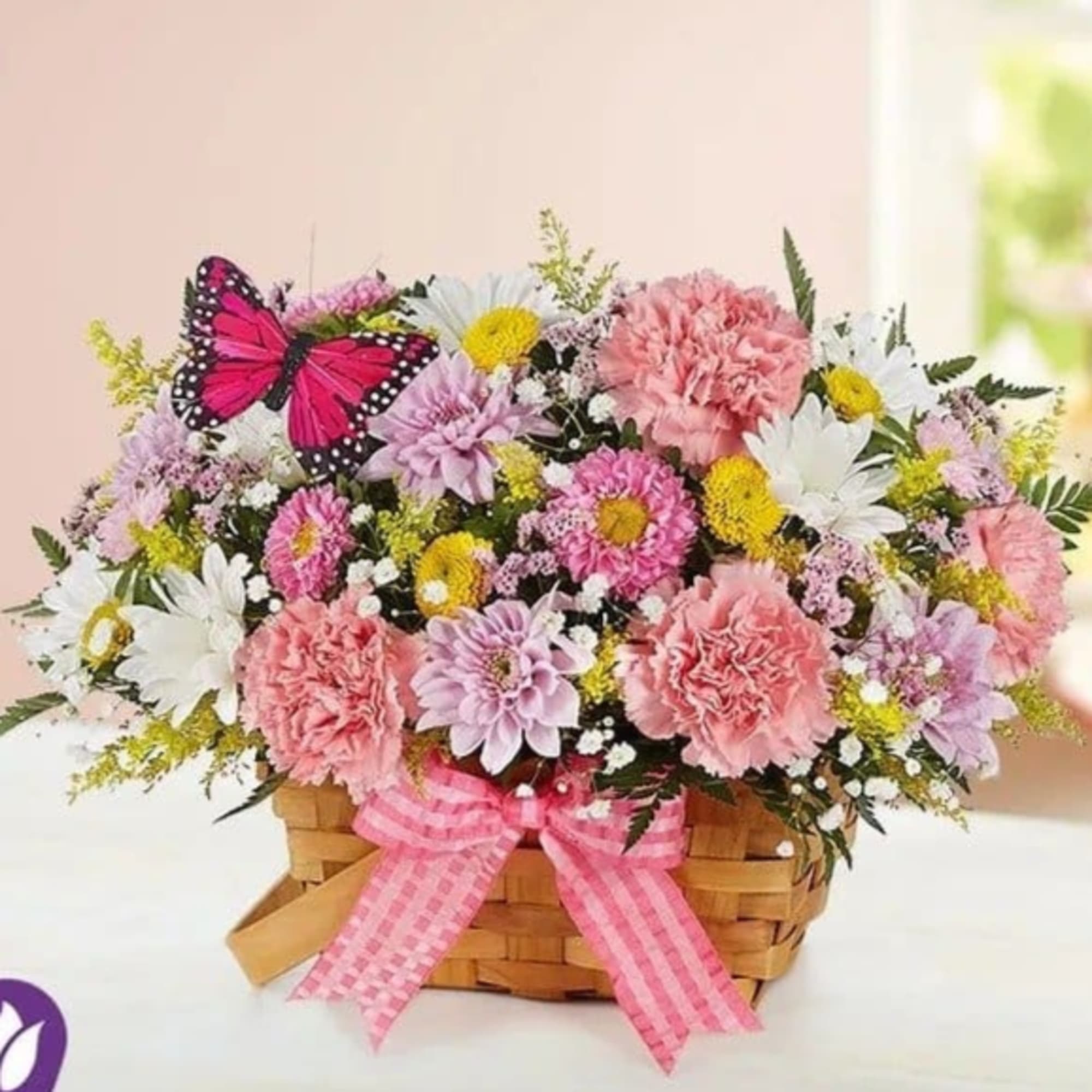 Our charming basket of blooms is an easy, go-to gift for any