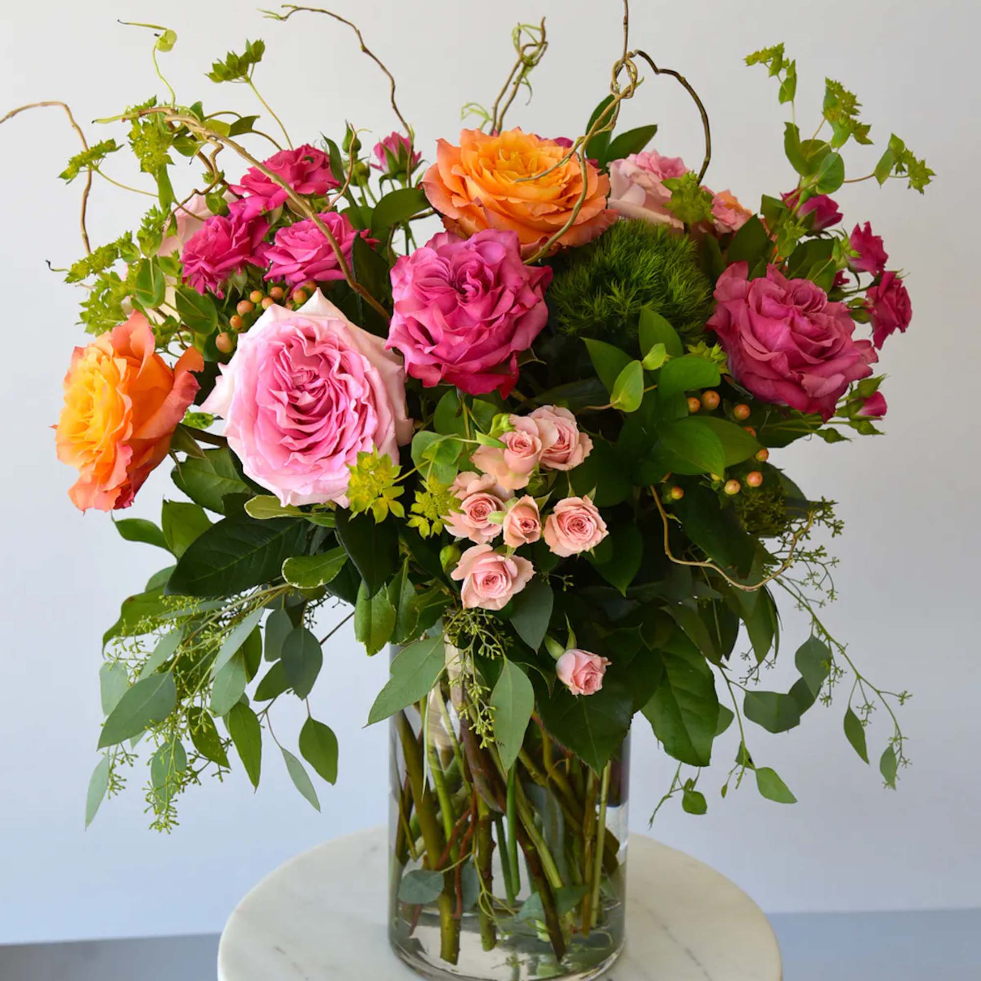 A beautiful collection of stunning premium roses with spray roses in vibrant