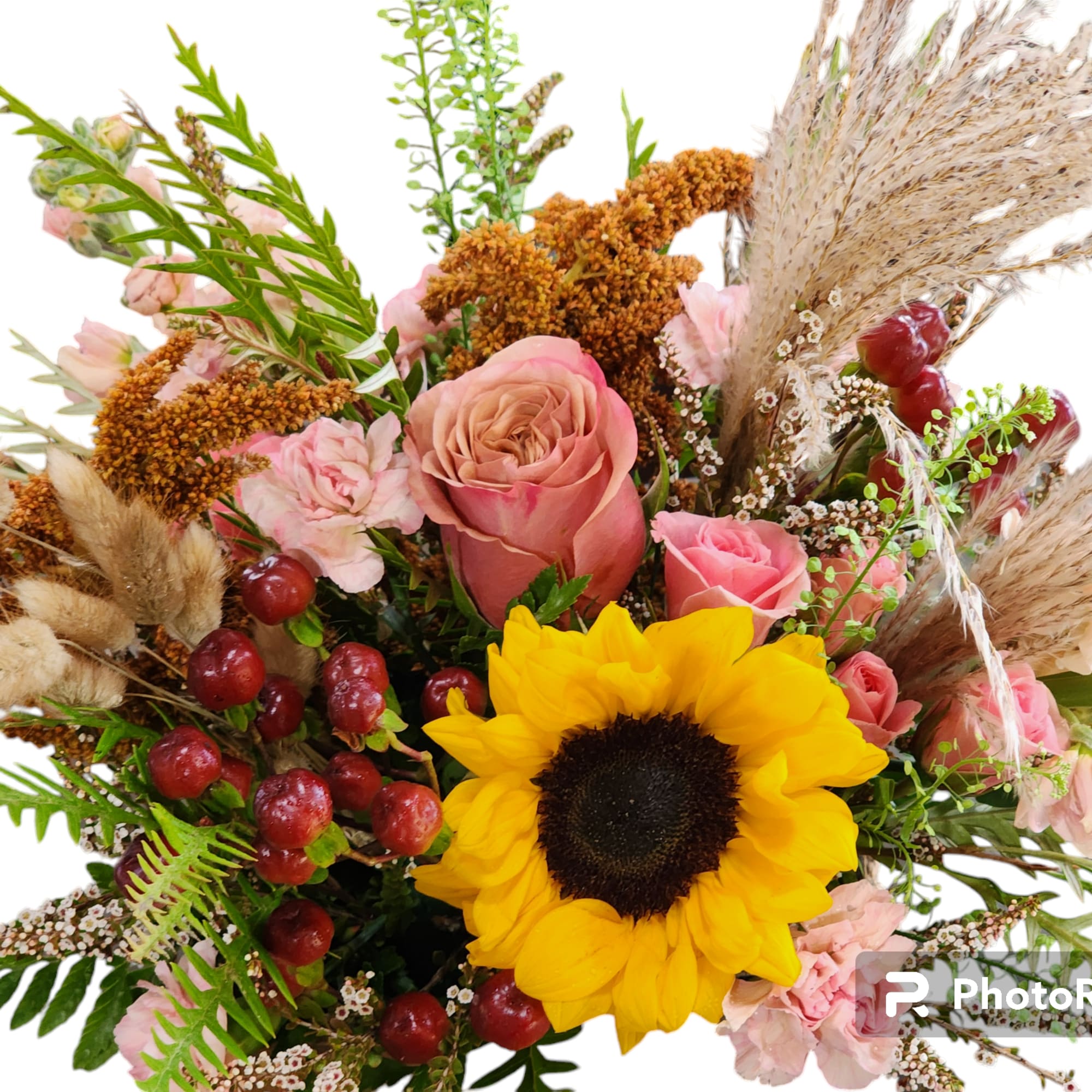 Bouquet with a sunflower, pink roses, and dried grasses