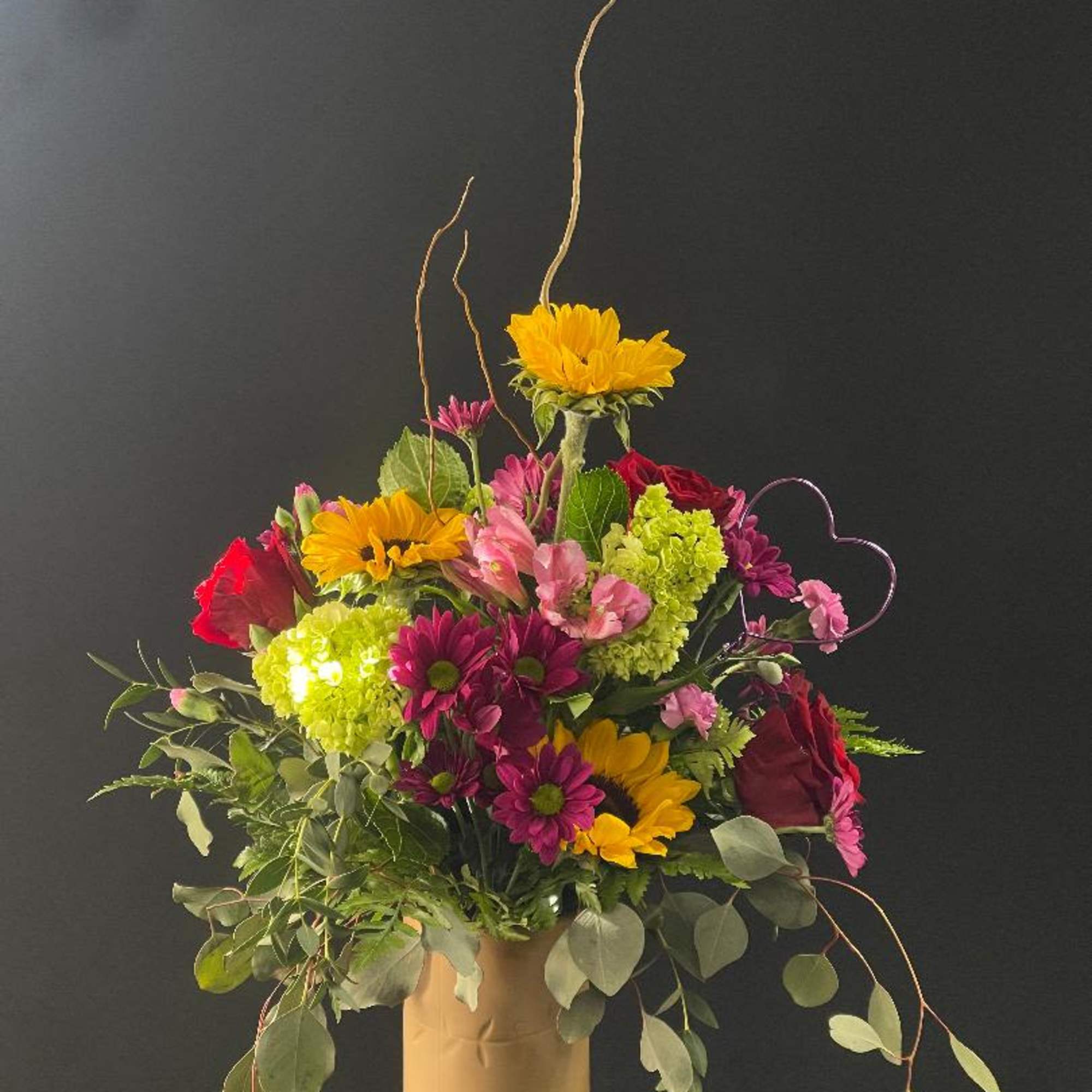 Beautiful, rustic vase with glossy red on the inside.