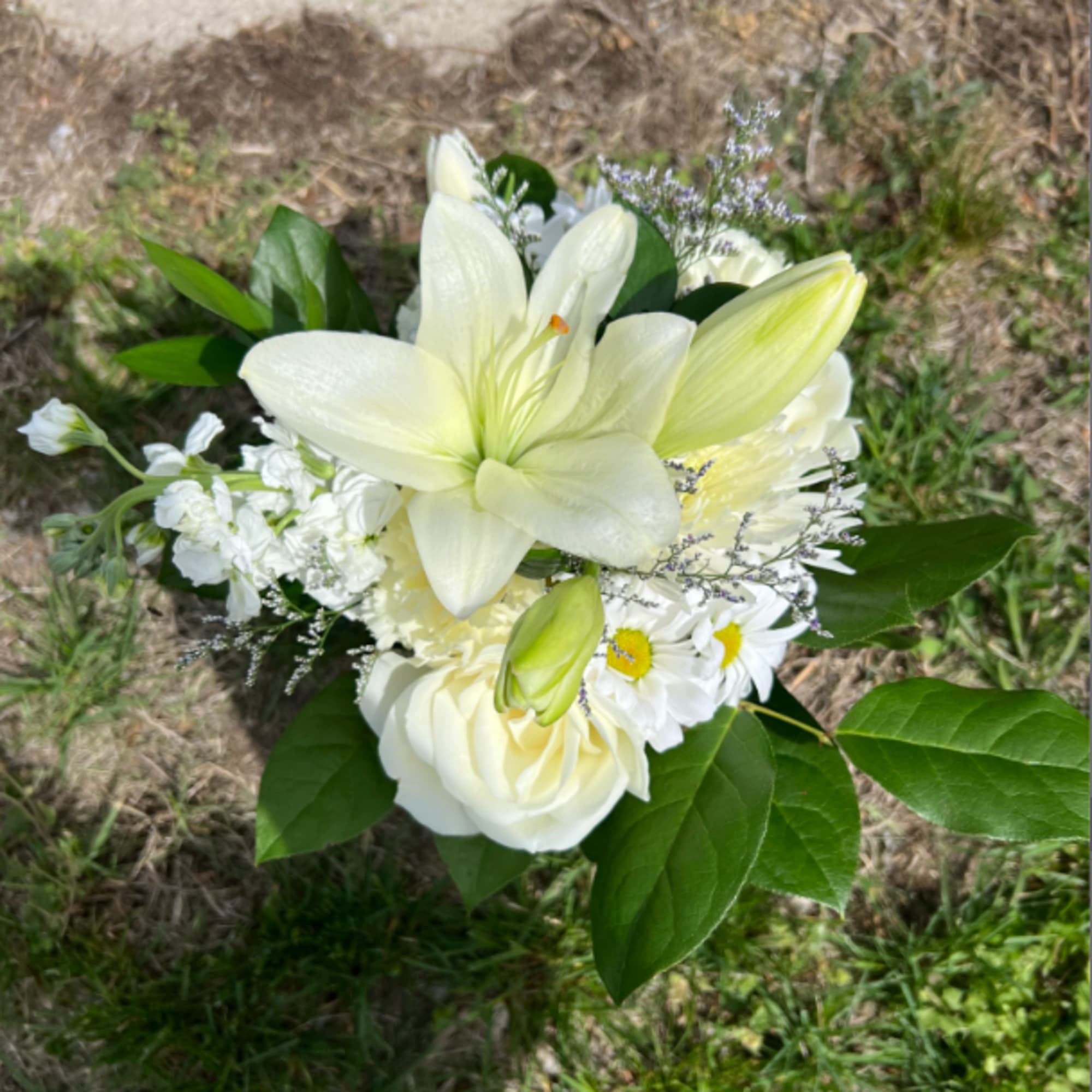 An elegant hand-tied bouquet that will compliment any outfit. Filled with mixed
