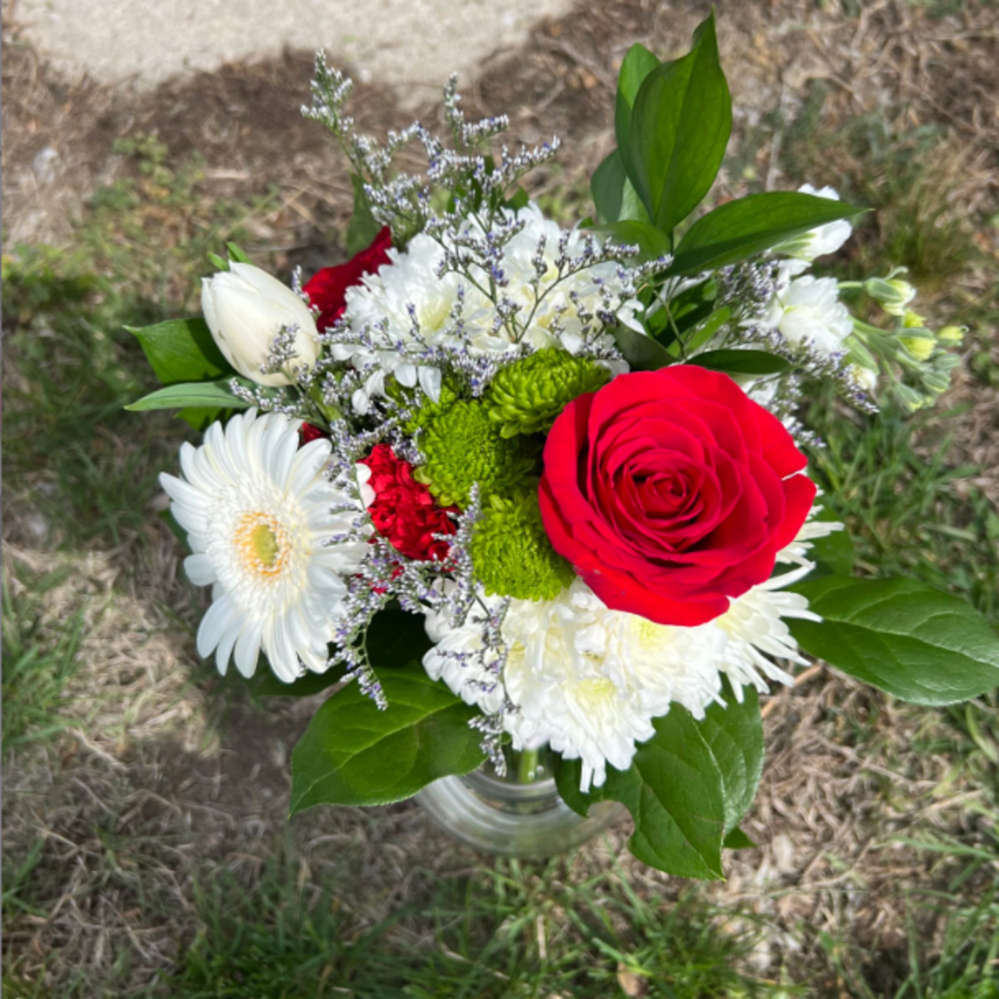 An elegant hand-tied bouquet that will compliment any outfit. Filled with mixed