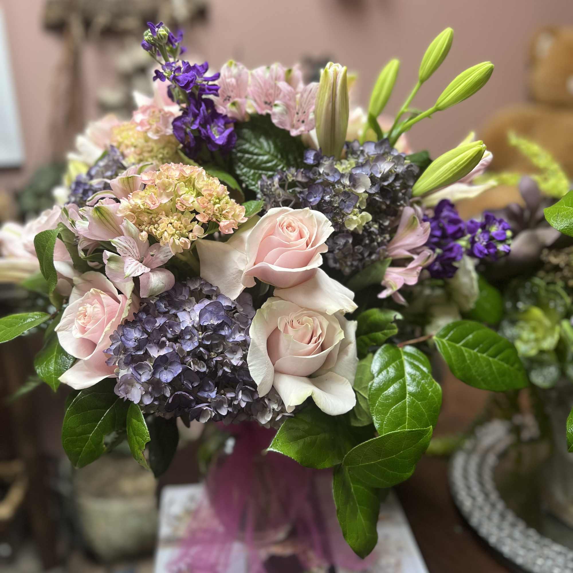Bouquet of pale pink roses, purple hydrangeas, and lilies