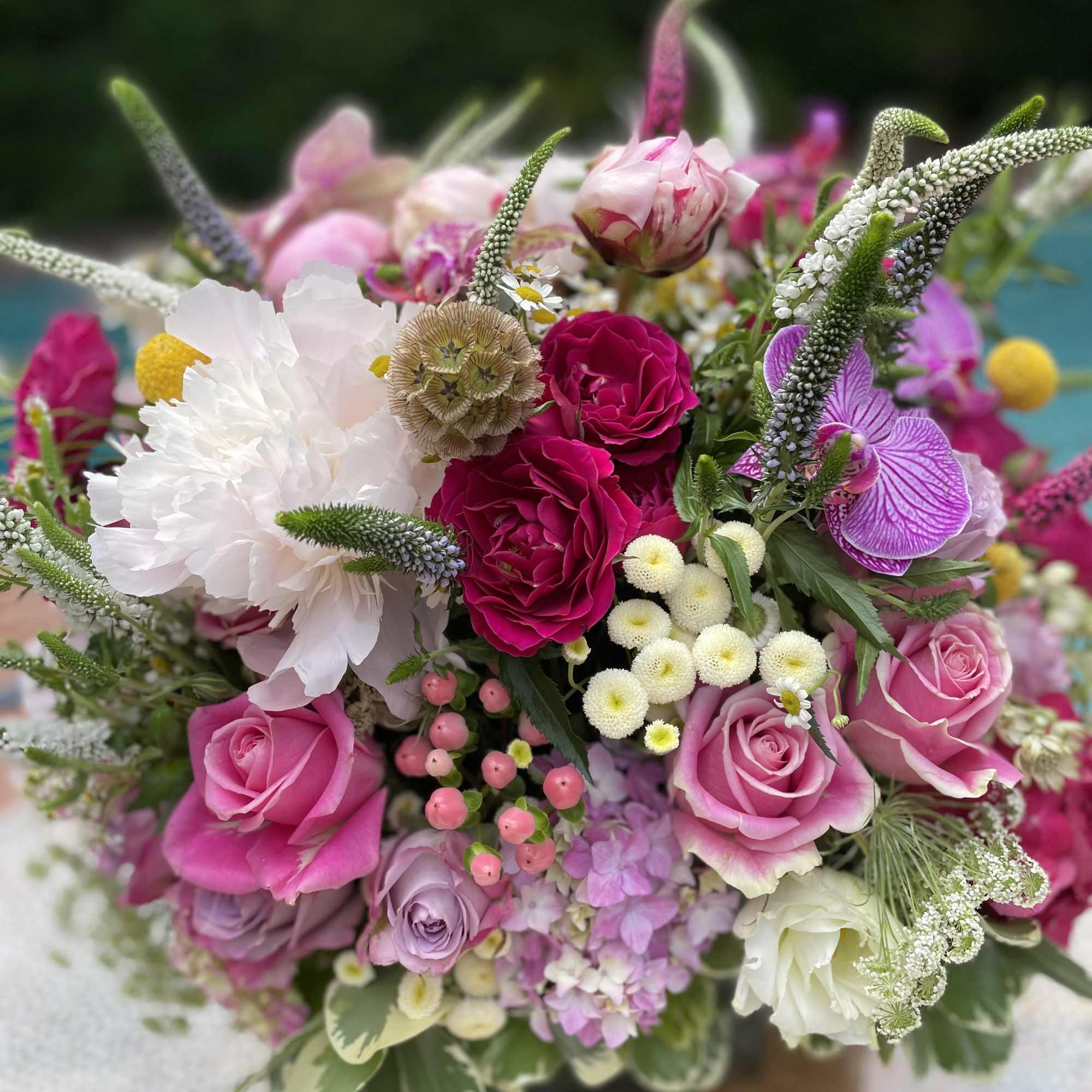 Mixed bouquet of pink and white roses with assorted blooms