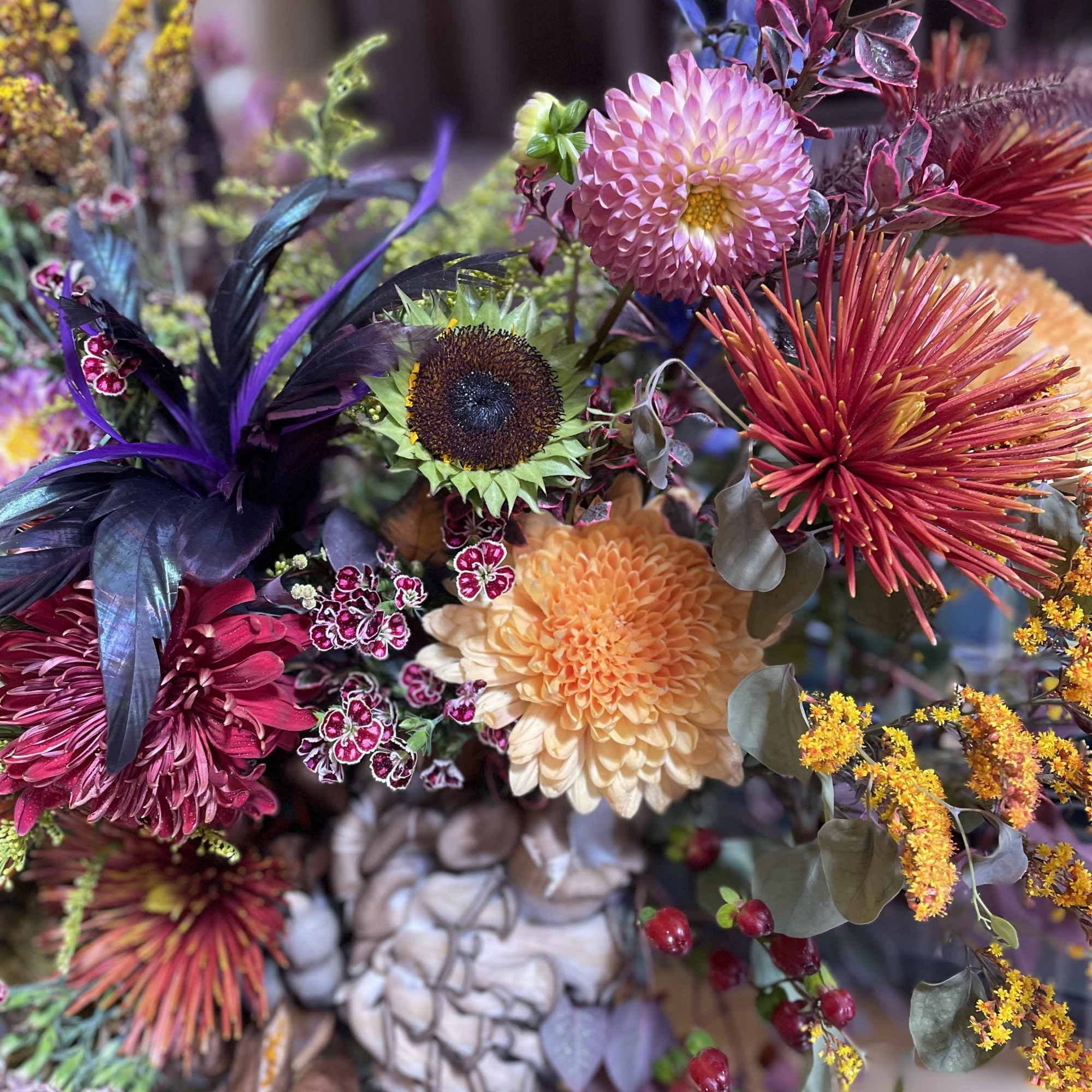 Colorful bouquet with dahlias, sunflower, and spiky blooms
