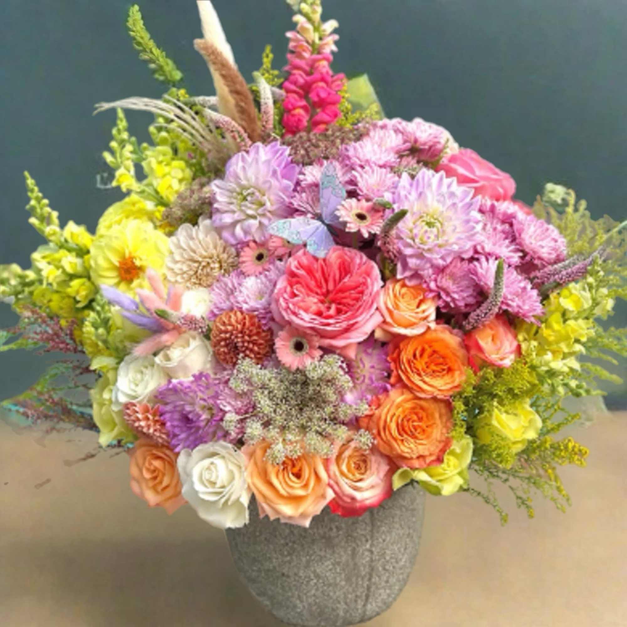 Colorful mixed bouquet in a gray vase with roses and daisies, photo 3 of 3