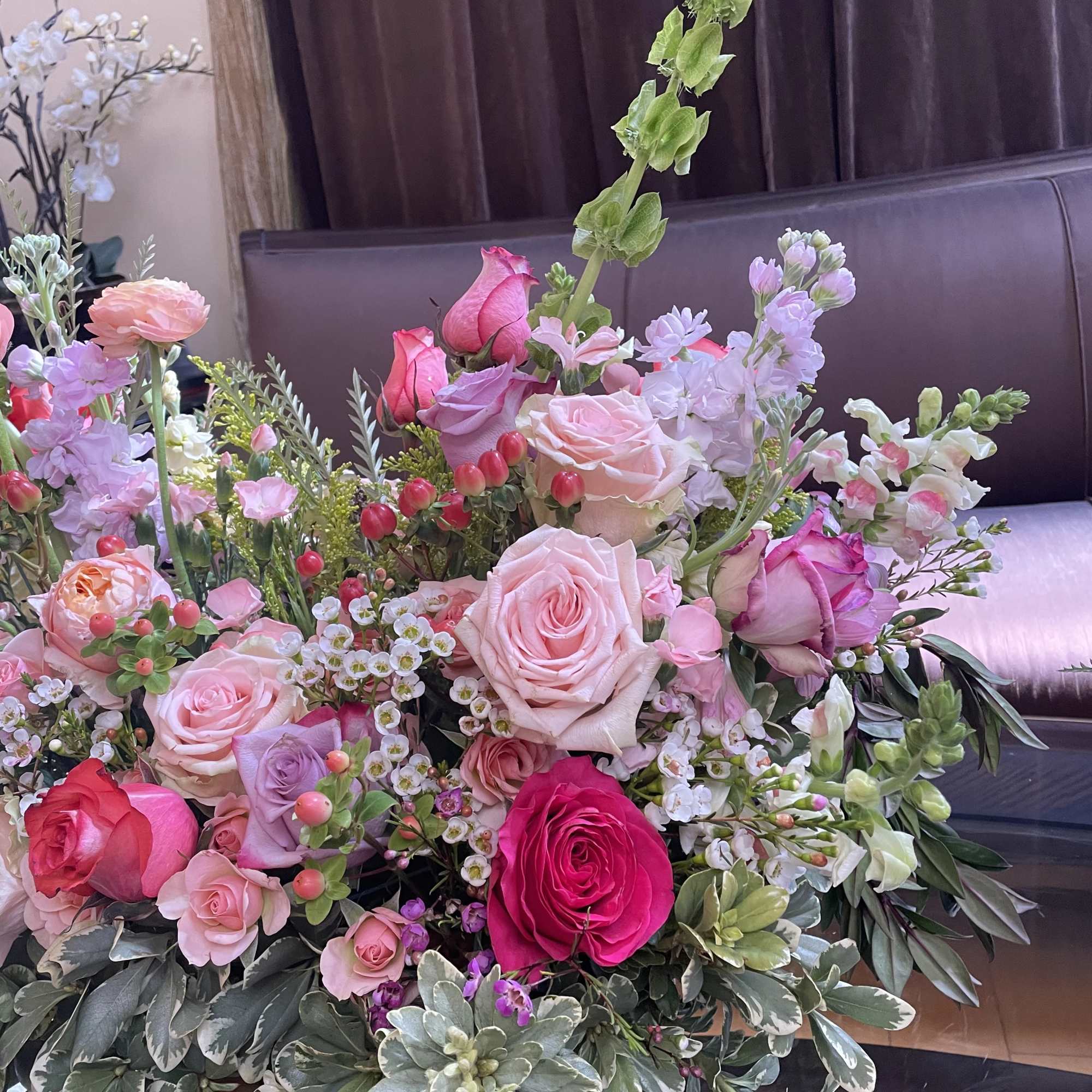 Large mixed bouquet of pink and white roses with assorted blooms