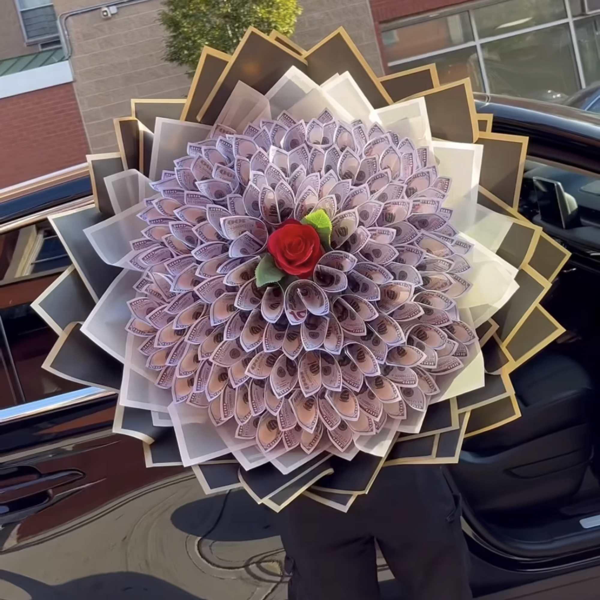 Money bouquet with a red rose center