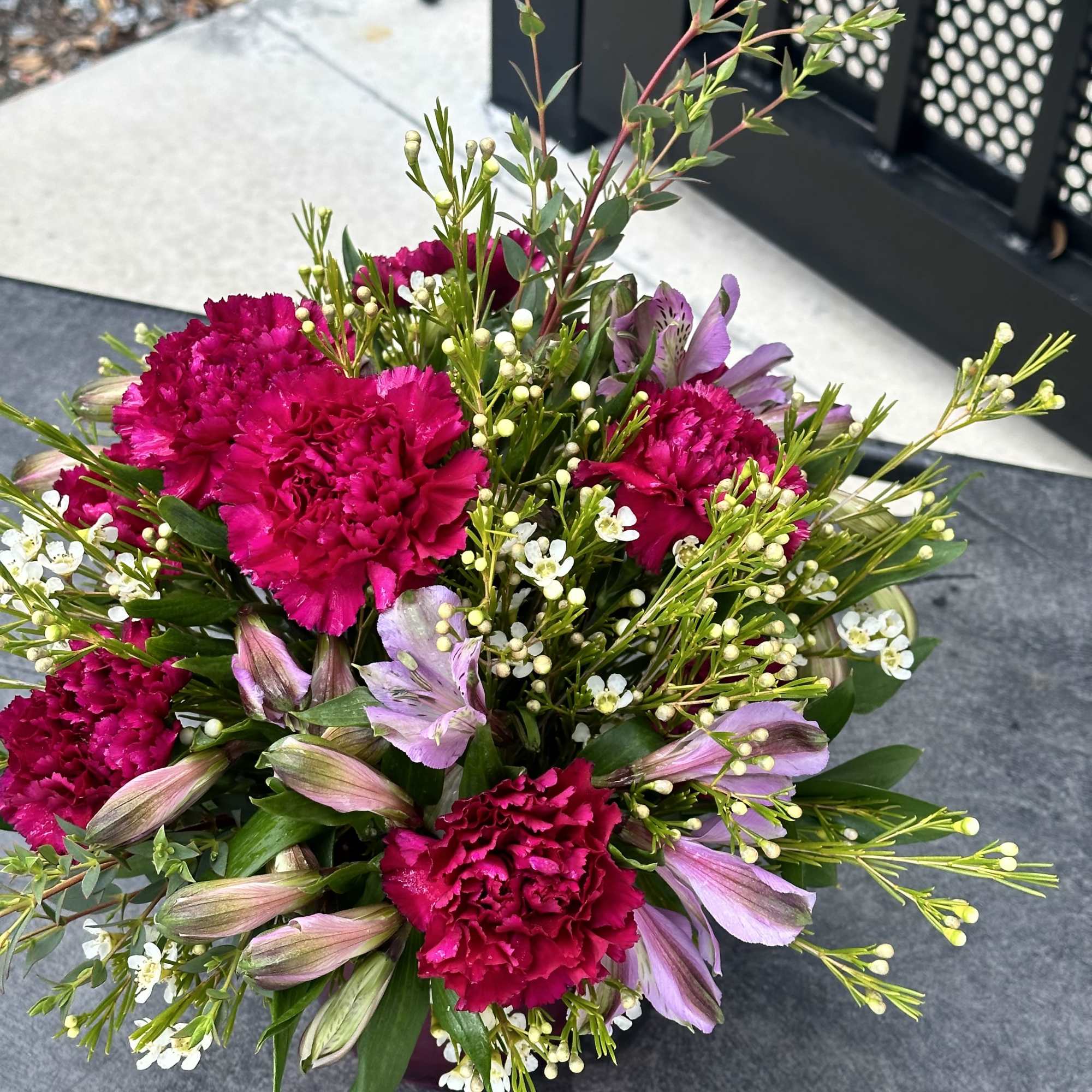 Bouquet of hot pink carnations and lavender alstroemeria