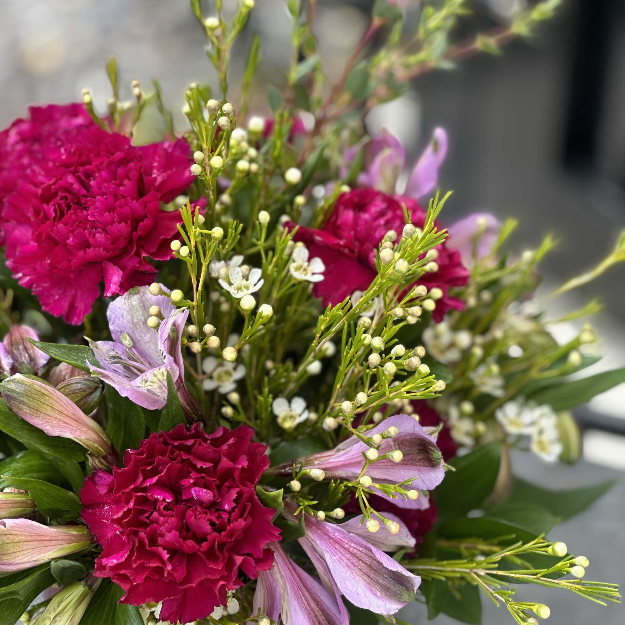 Bouquet of magenta carnations and pale pink alstroemeria