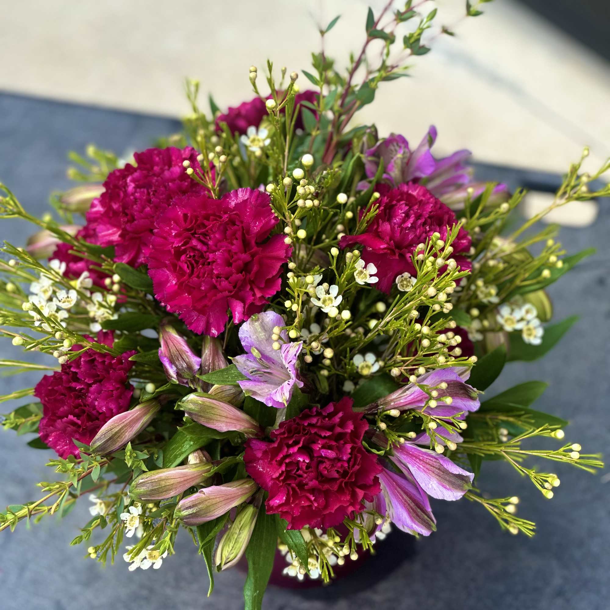 Bouquet of magenta carnations and purple alstroemeria