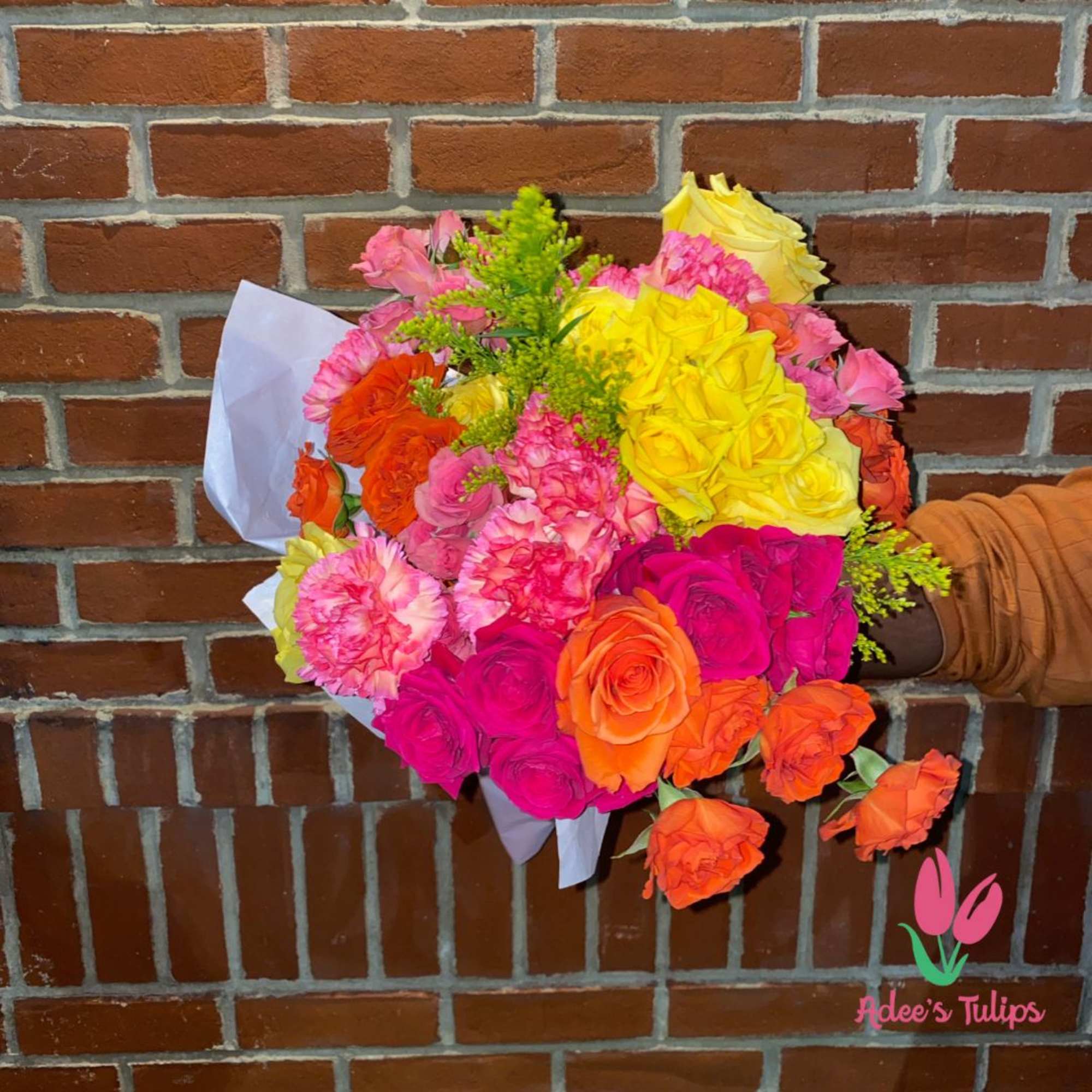 Bright mixed bouquet of roses and carnations wrapped in white paper, photo 3 of 6