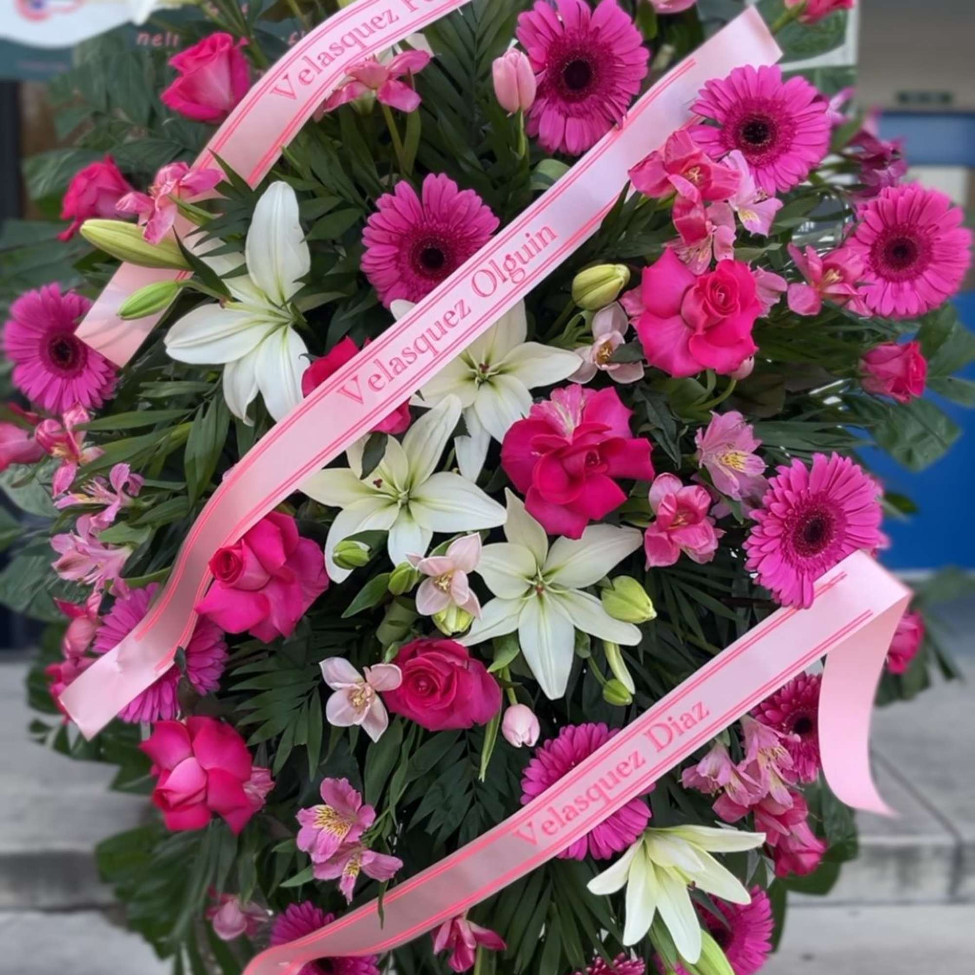 Bright, ceremonial pink and white standing spray designed for sympathy and memorials, photo 2 of 2