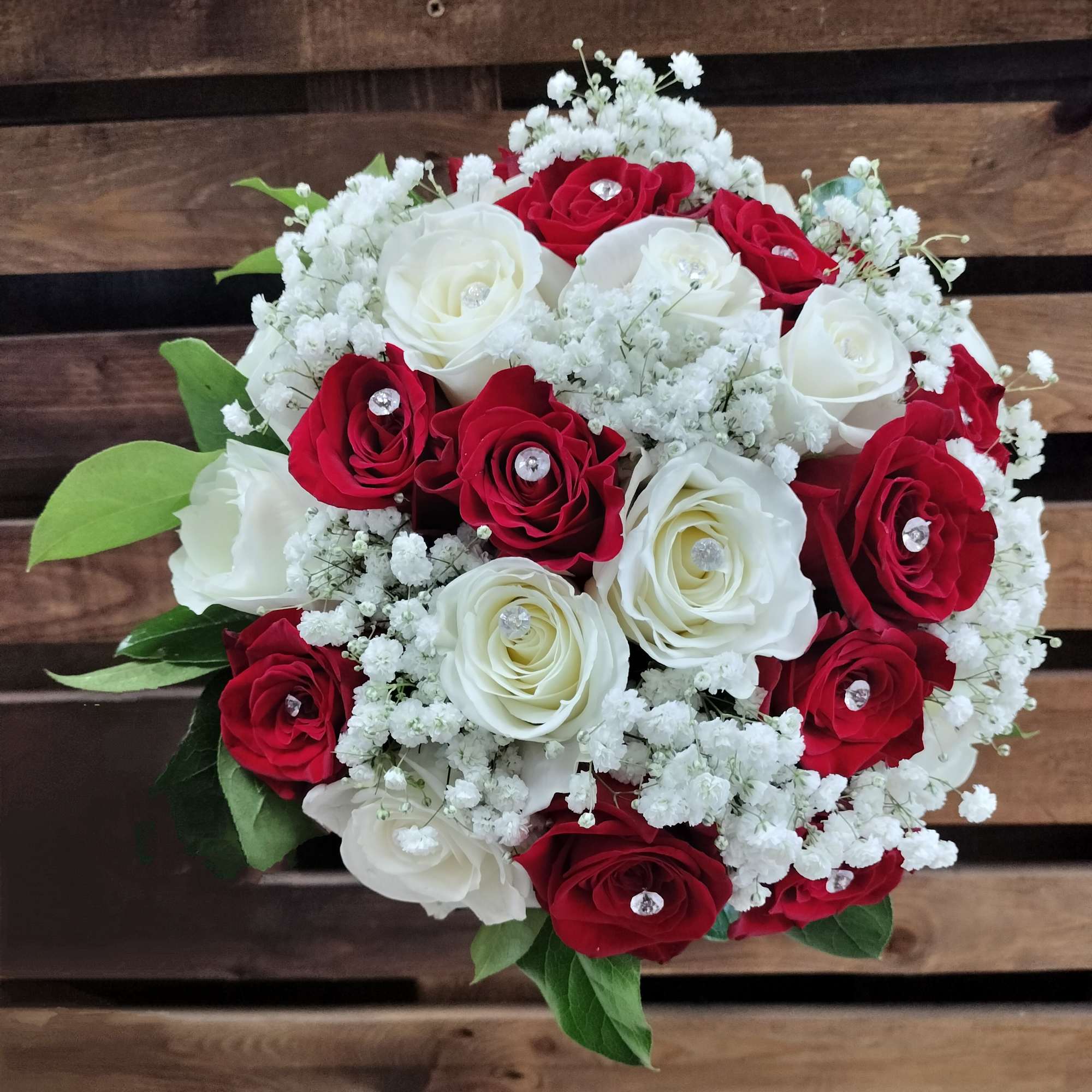 Bouquet of red and white roses with baby's breath