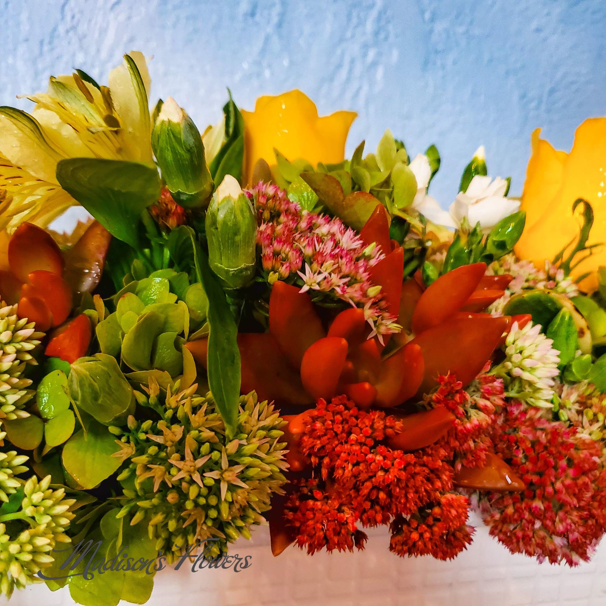 Mixed bouquet with yellow, red, pink, and white flowers