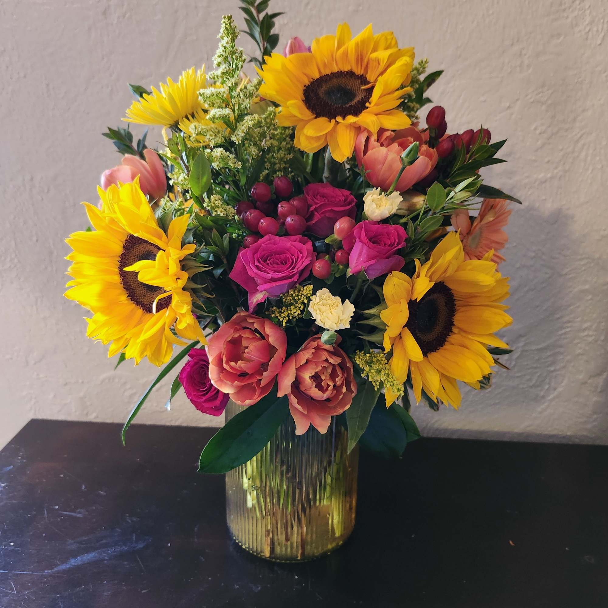 Beautiful sunflowers with bright tulips and a touch of hot pink sweetheart