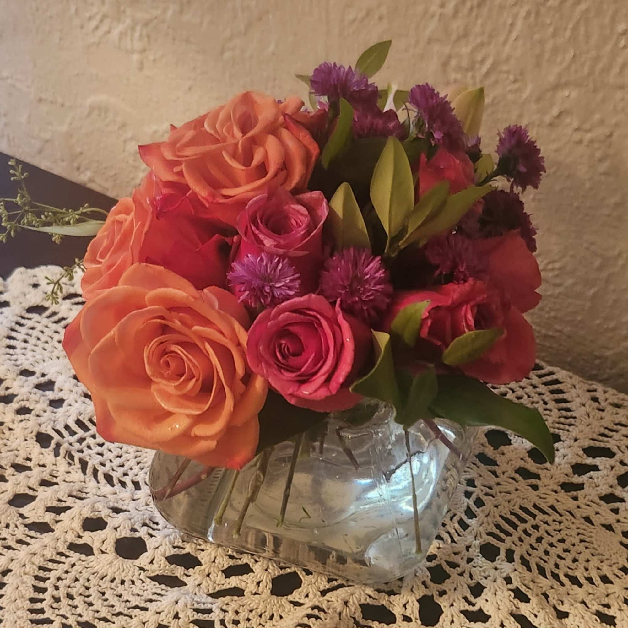 Orange Sweetheart rose, with hot pink sweethearts and a touch of purple, photo 2 of 2