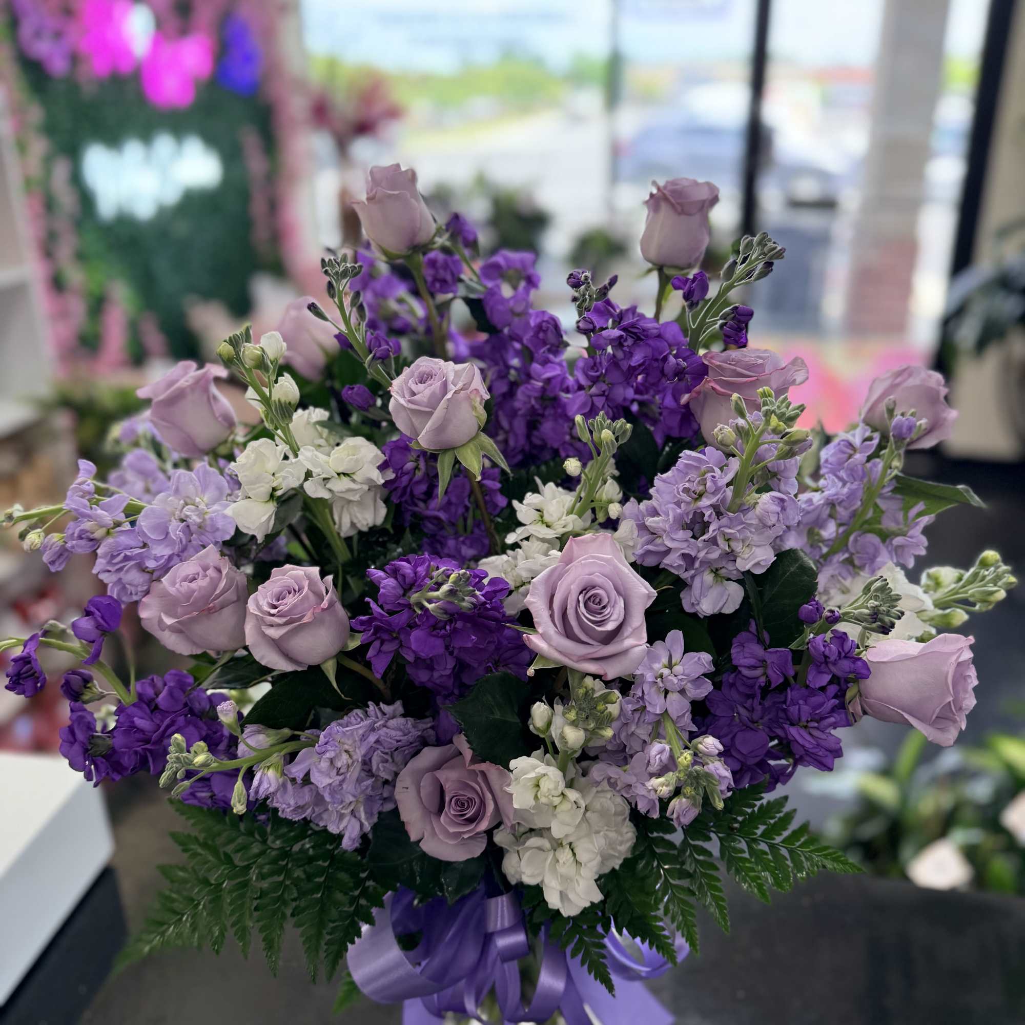 A soft and elegant arrangement featuring delicate lavender looms. Designed in a, photo 2 of 3