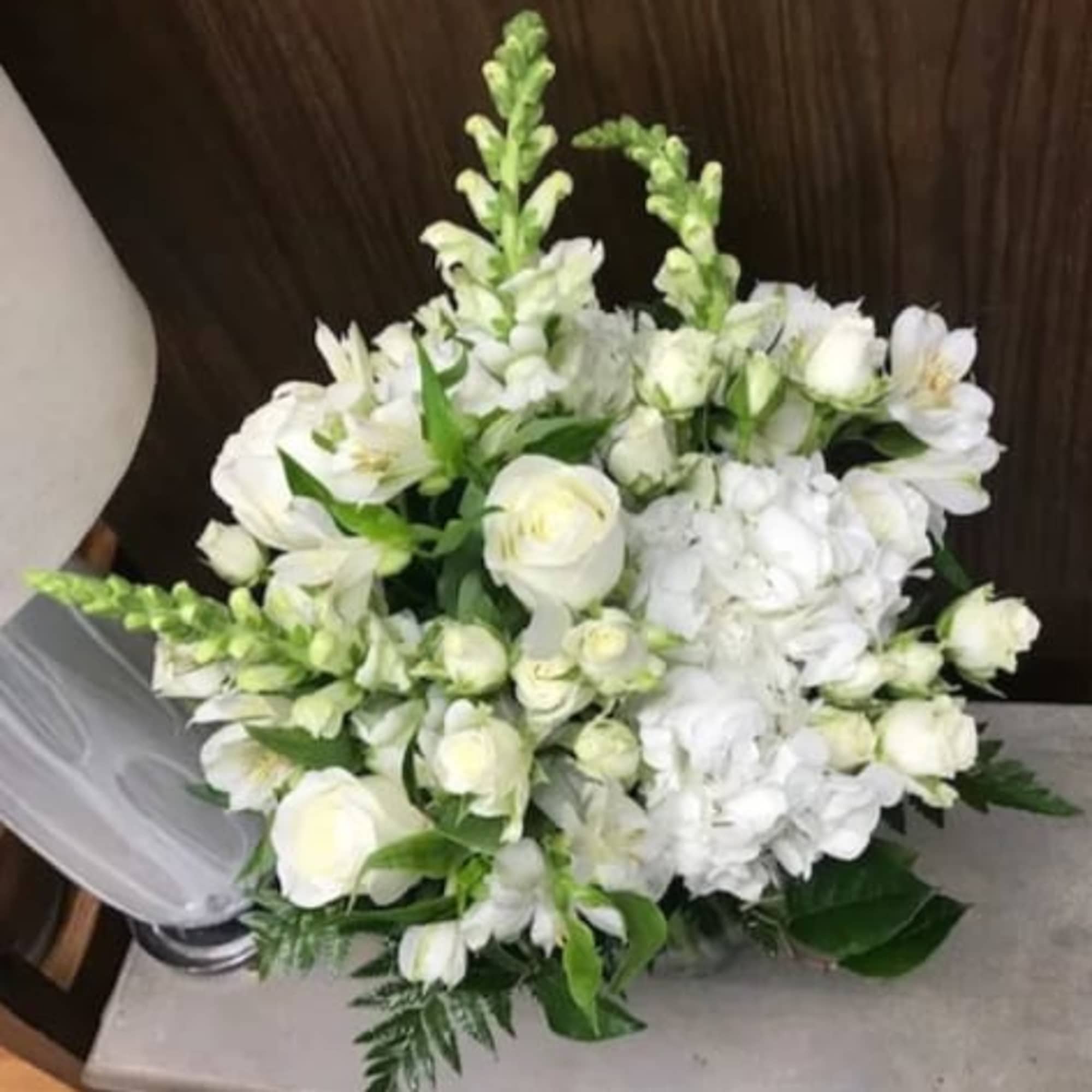 This monochromatic bouquet features white Roses, Spray Roses, Snapdragons, Hydrangea and Alstroemeria., photo 2 of 2