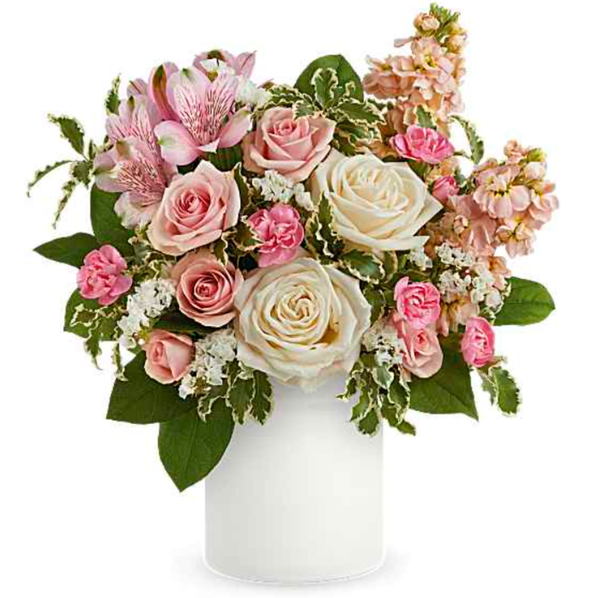 Pink and white roses in a white vase with mixed blooms