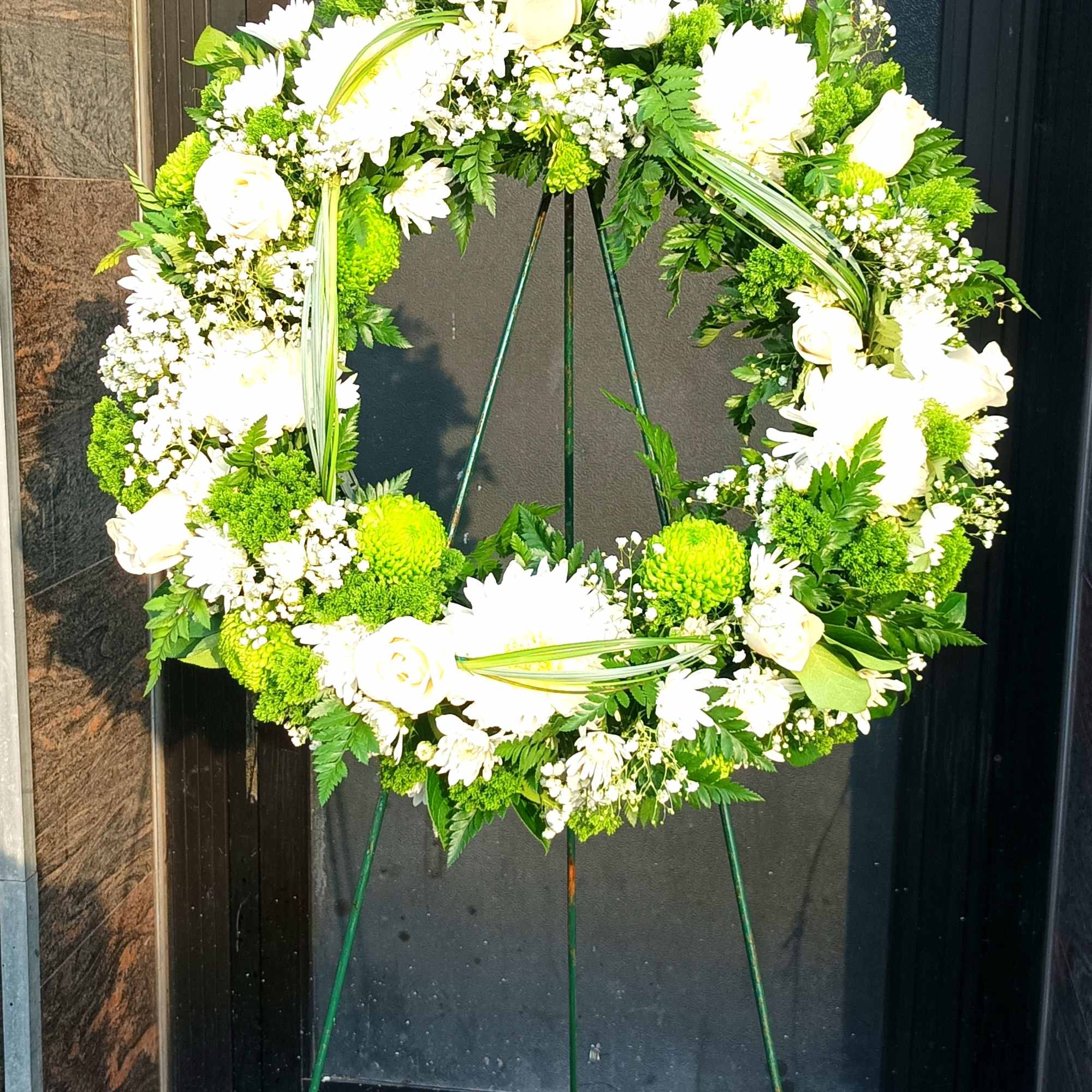A beautiful white and green tribute wreath that calms, this easel arrangement, photo 2 of 5