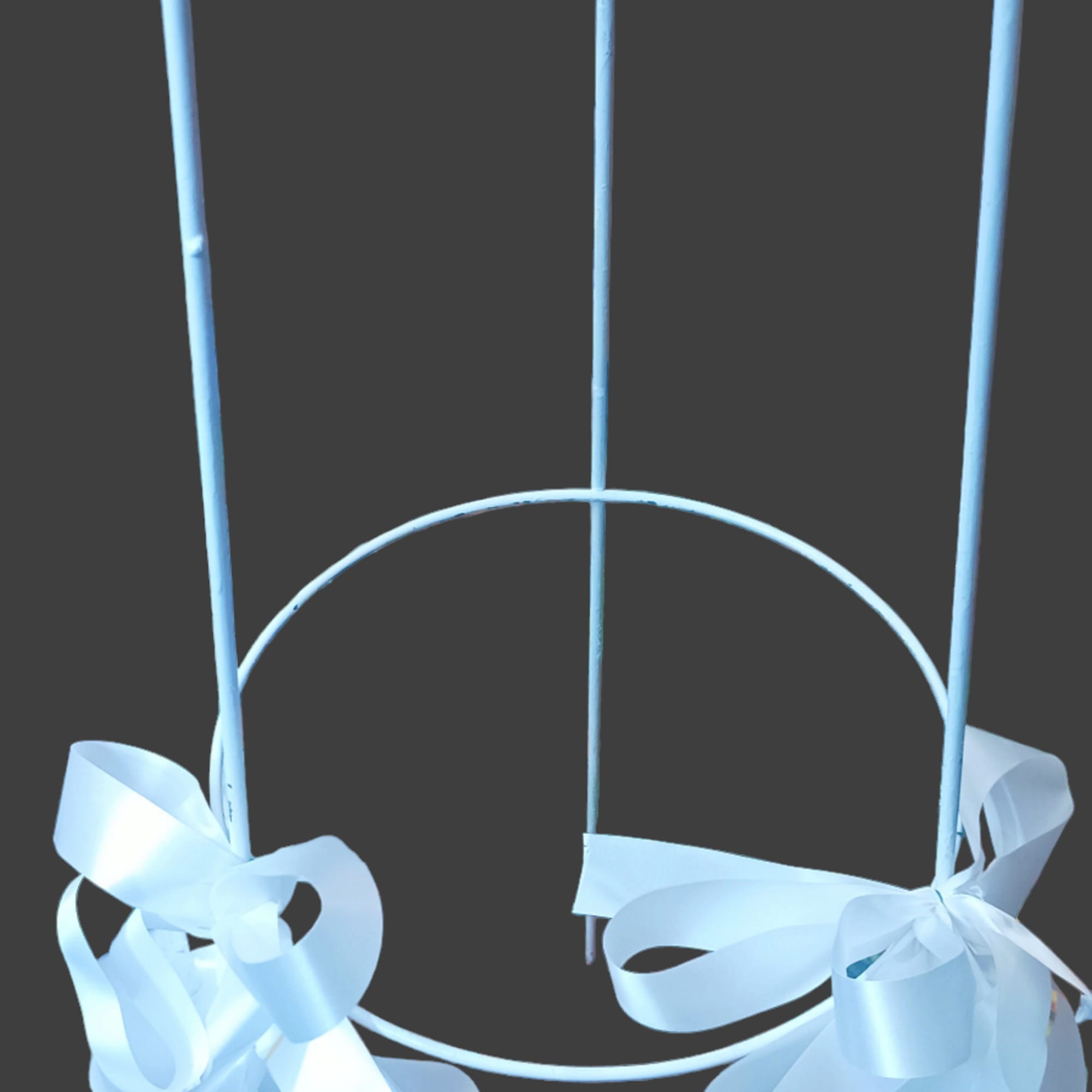 White metal floral stand with two satin bows