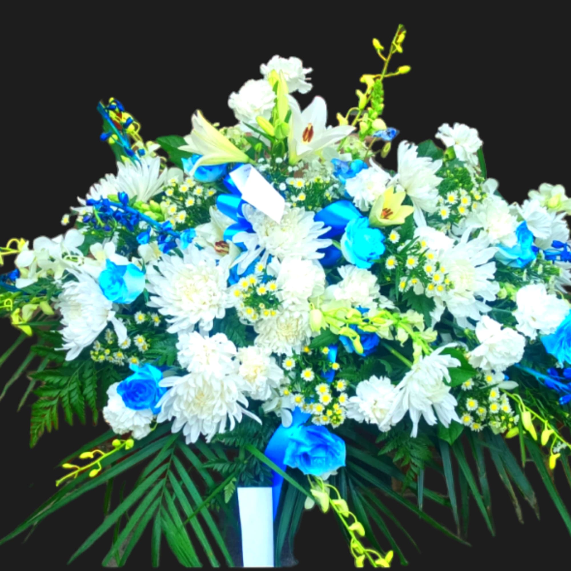 Large white and blue floral spray with lilies and daisies
