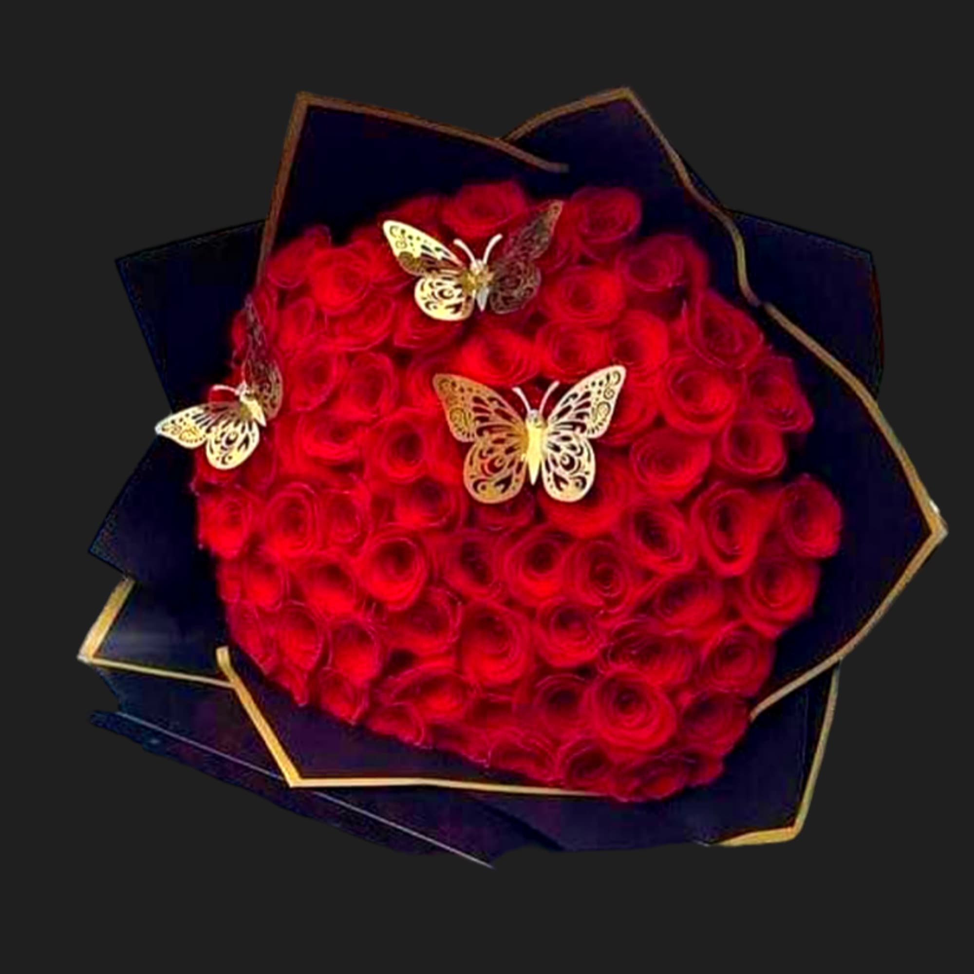 Heart-shaped bouquet of red roses with butterfly accents
