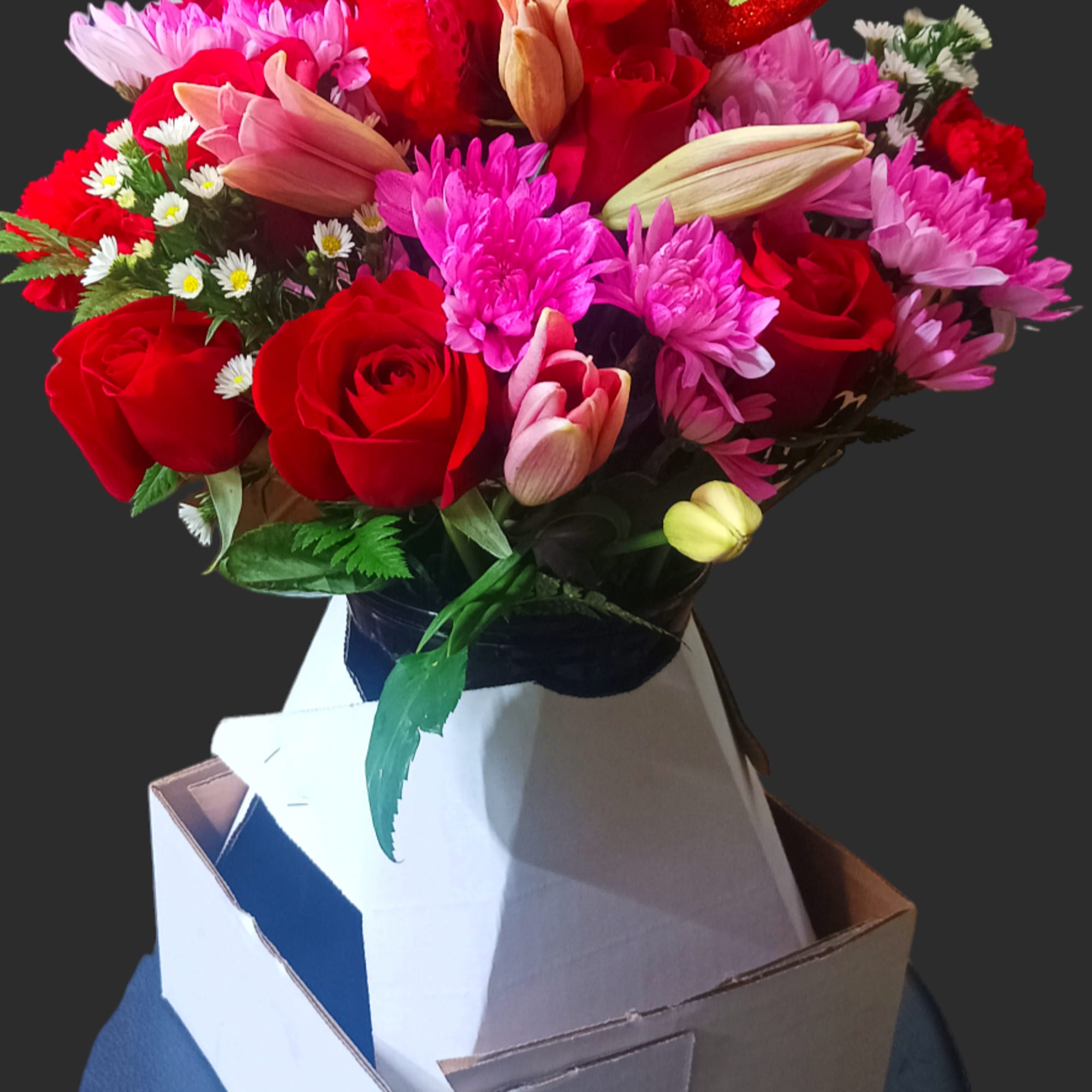 Bouquet of red roses, pink chrysanthemums, and a teddy bear topper