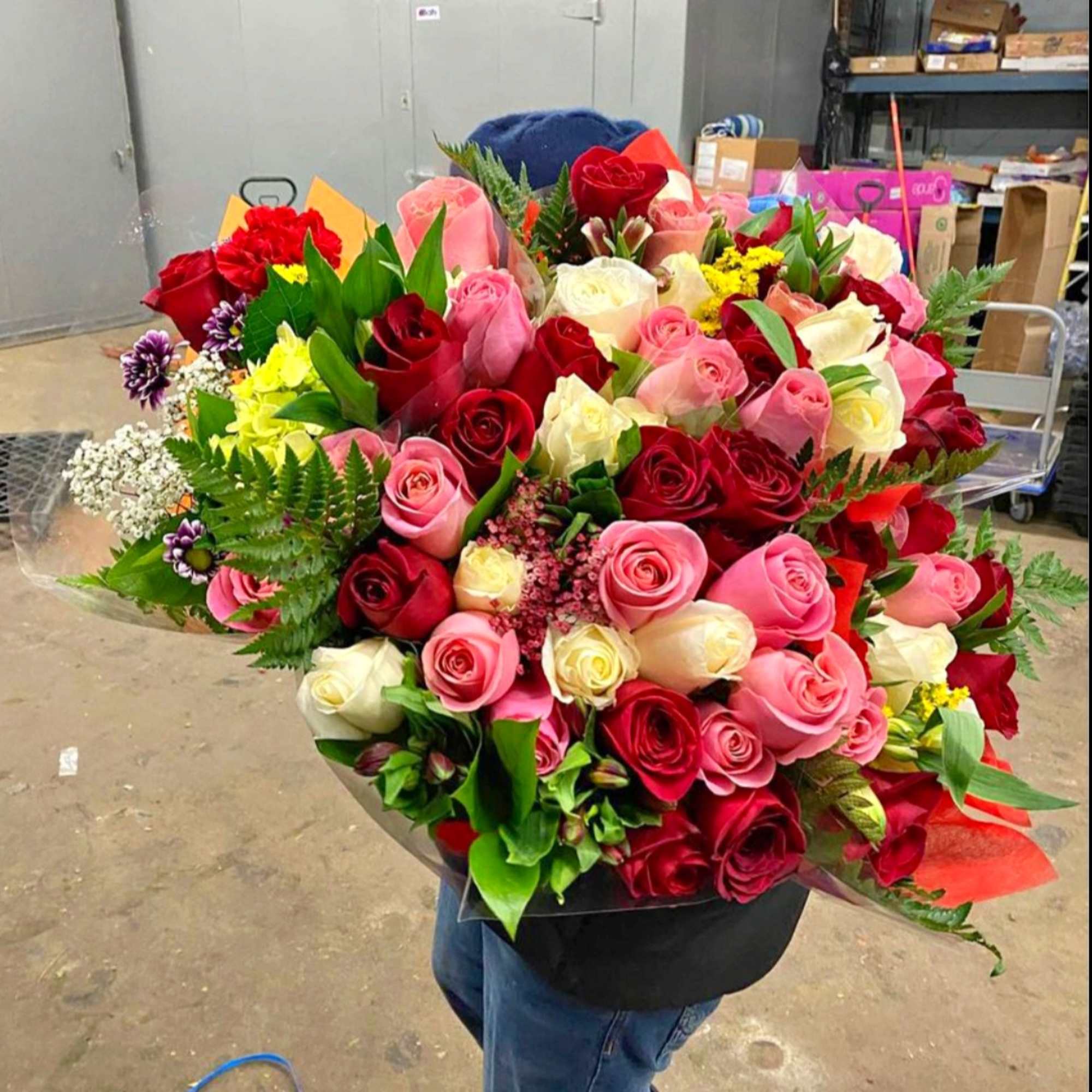 Large bouquet of red, pink, and white roses with mixed filler flowers, photo 3 of 3