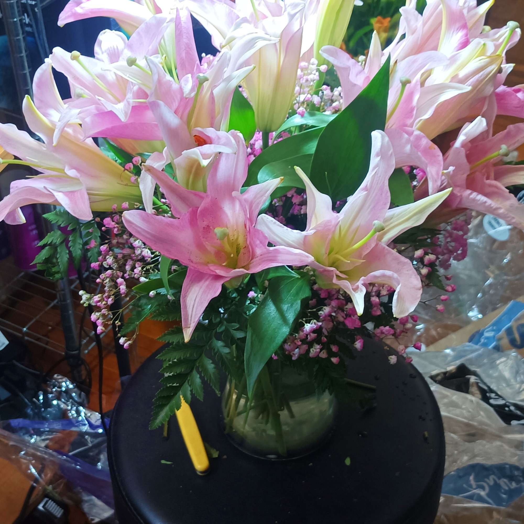 Pink and white lilies arranged in a glass vase, photo 2 of 5
