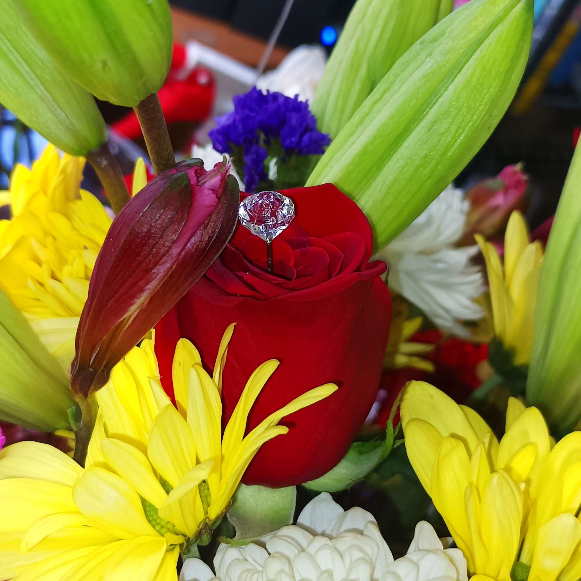 Red rose with lilies and yellow and white chrysanthemums