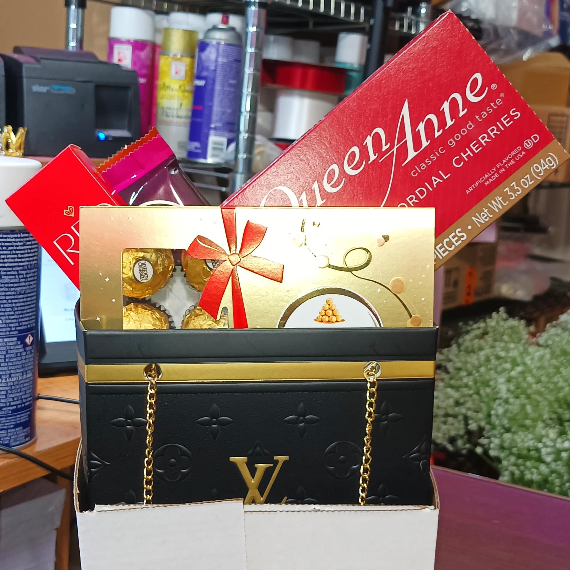 Gift box with chocolates and candy boxes on a table