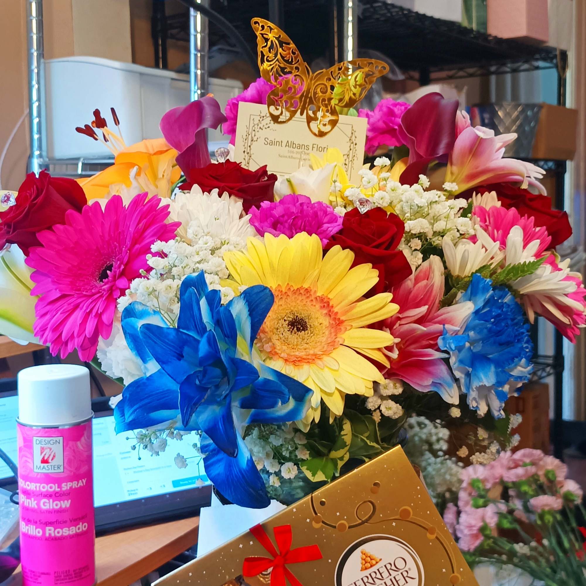 Bright mixed bouquet with a Ferrero Rocher box in front