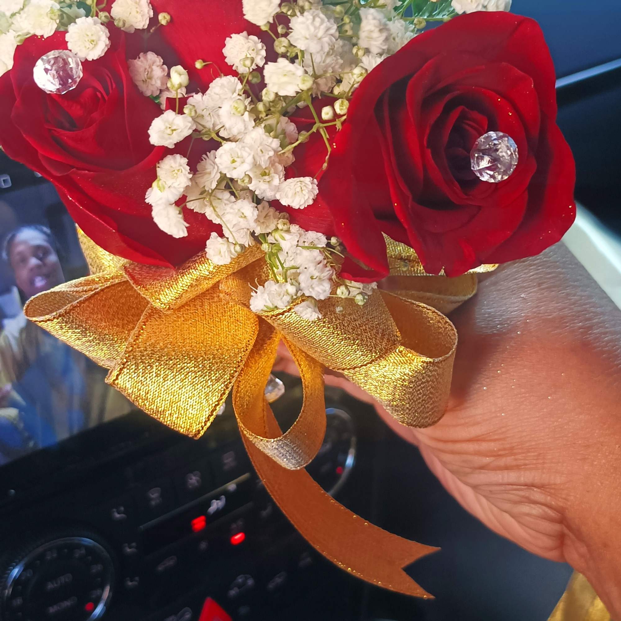 Small bouquet of red roses and white baby's breath with a gold ribbon, photo 4 of 8
