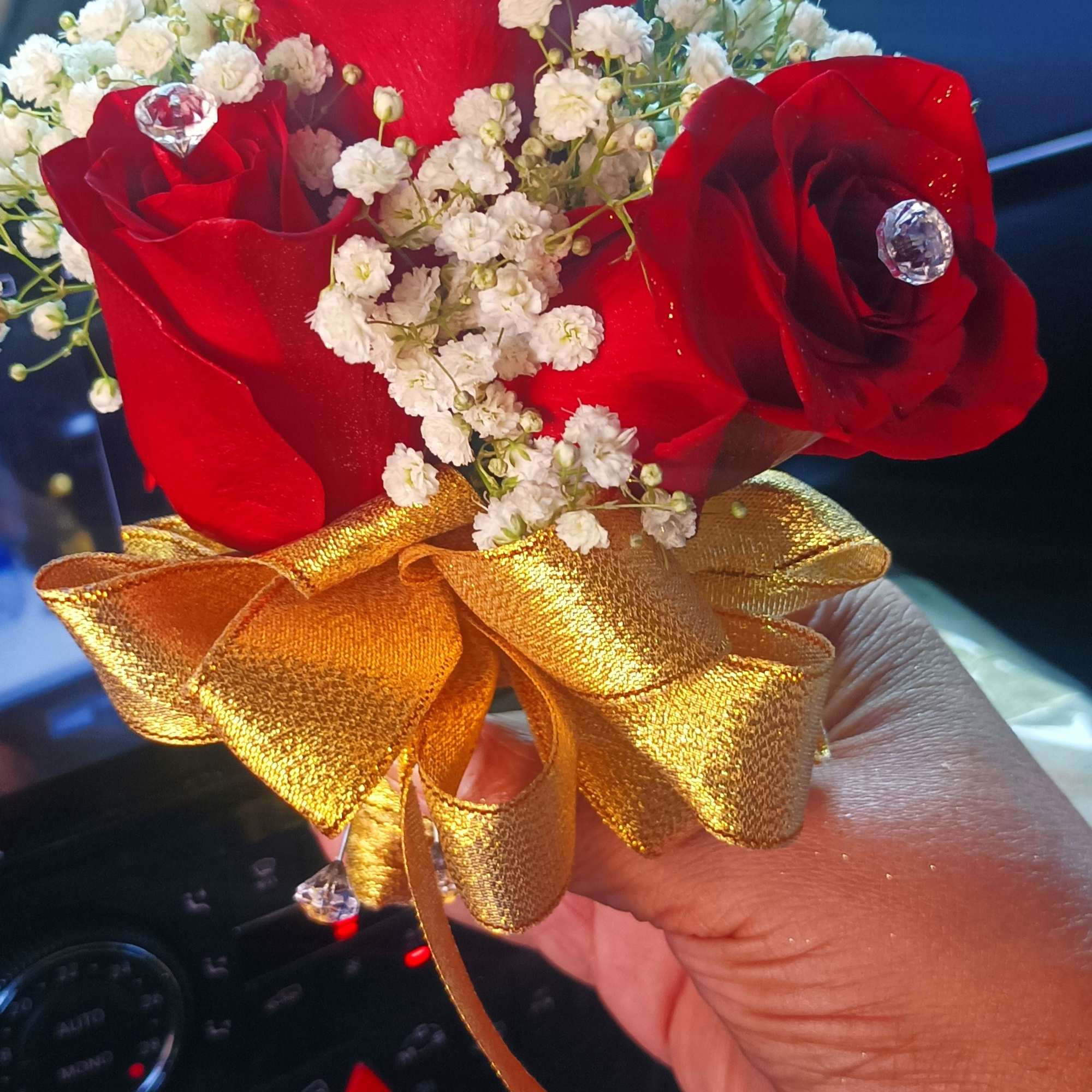 Small bouquet of red roses with white baby's breath and a gold ribbon, photo 6 of 8