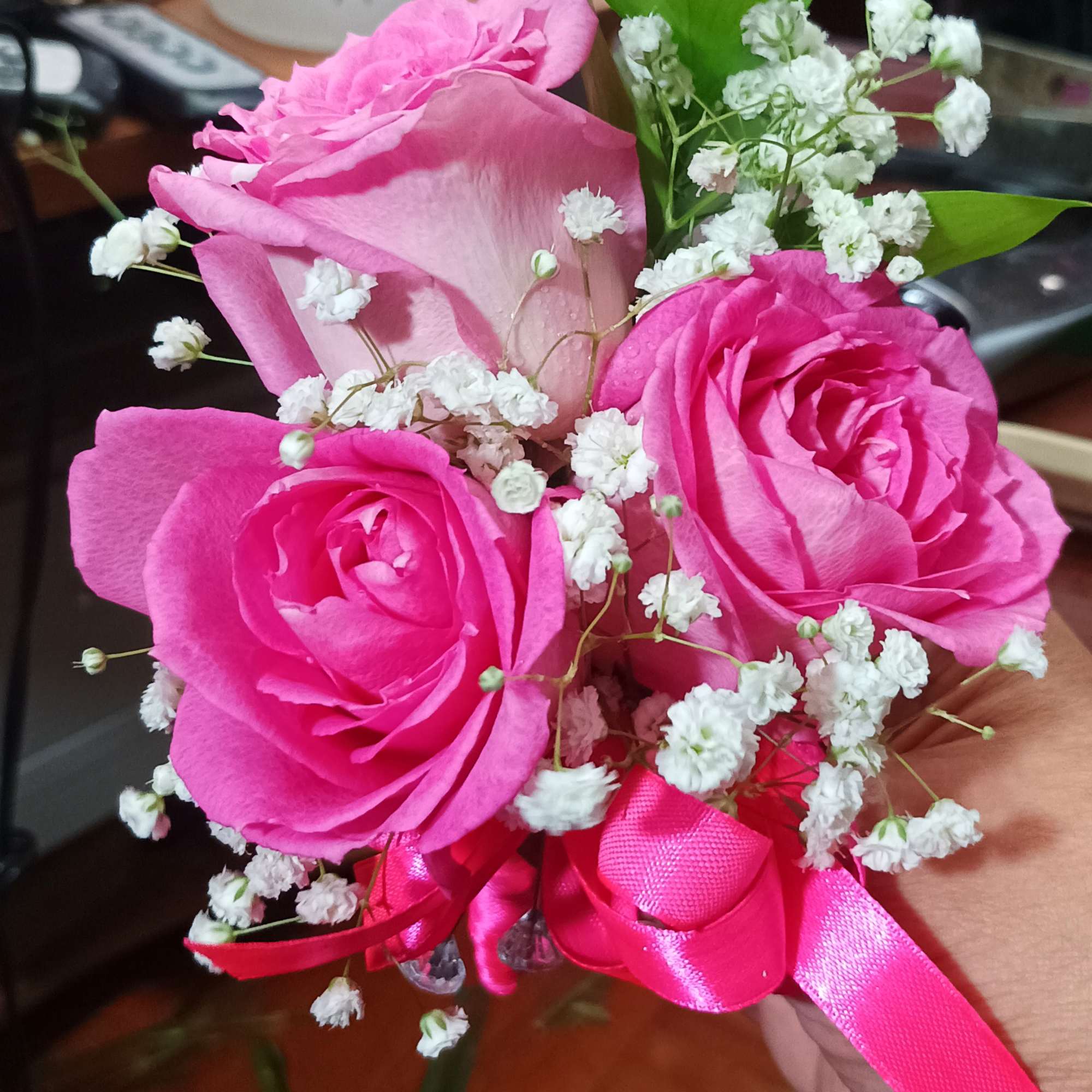 Pink rose bouquet with baby's breath and a pink ribbon