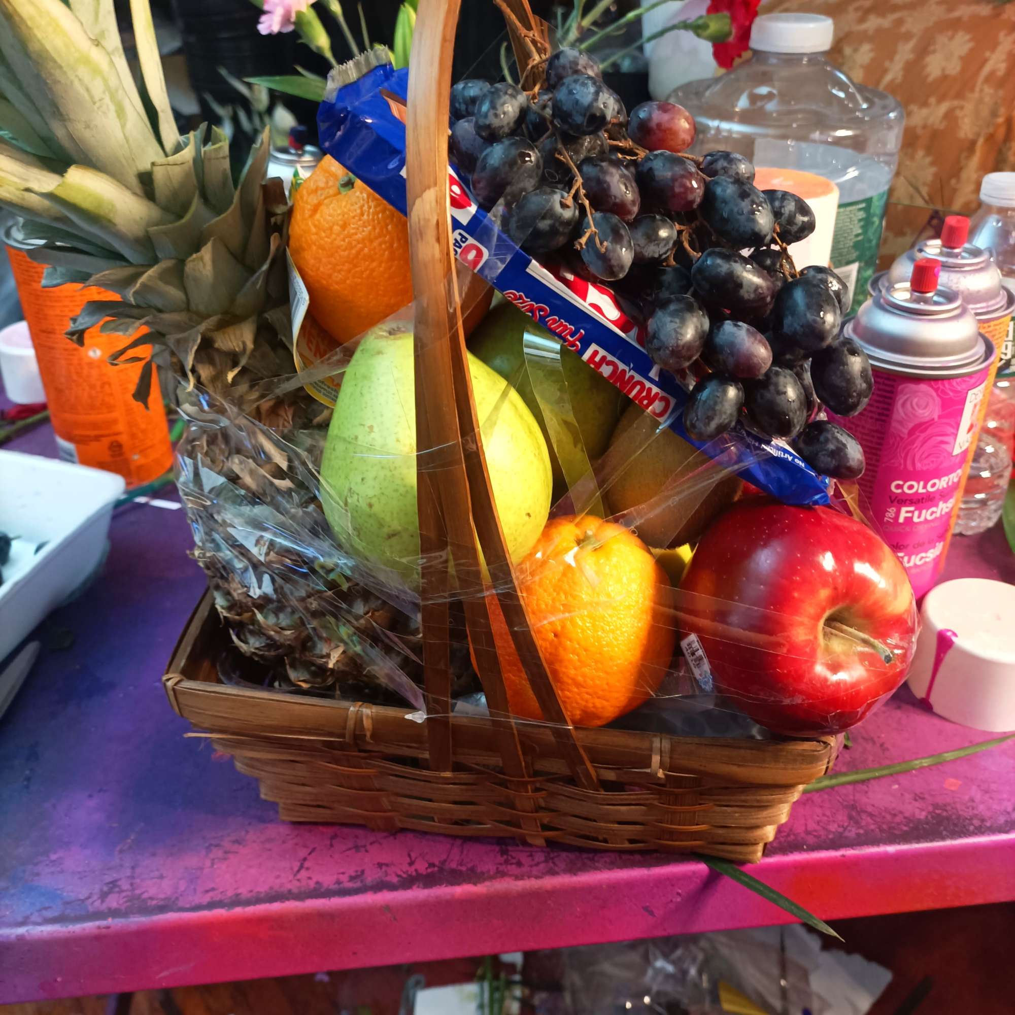Fruit basket with grapes, pineapple, oranges, pear, and apple, photo 2 of 4