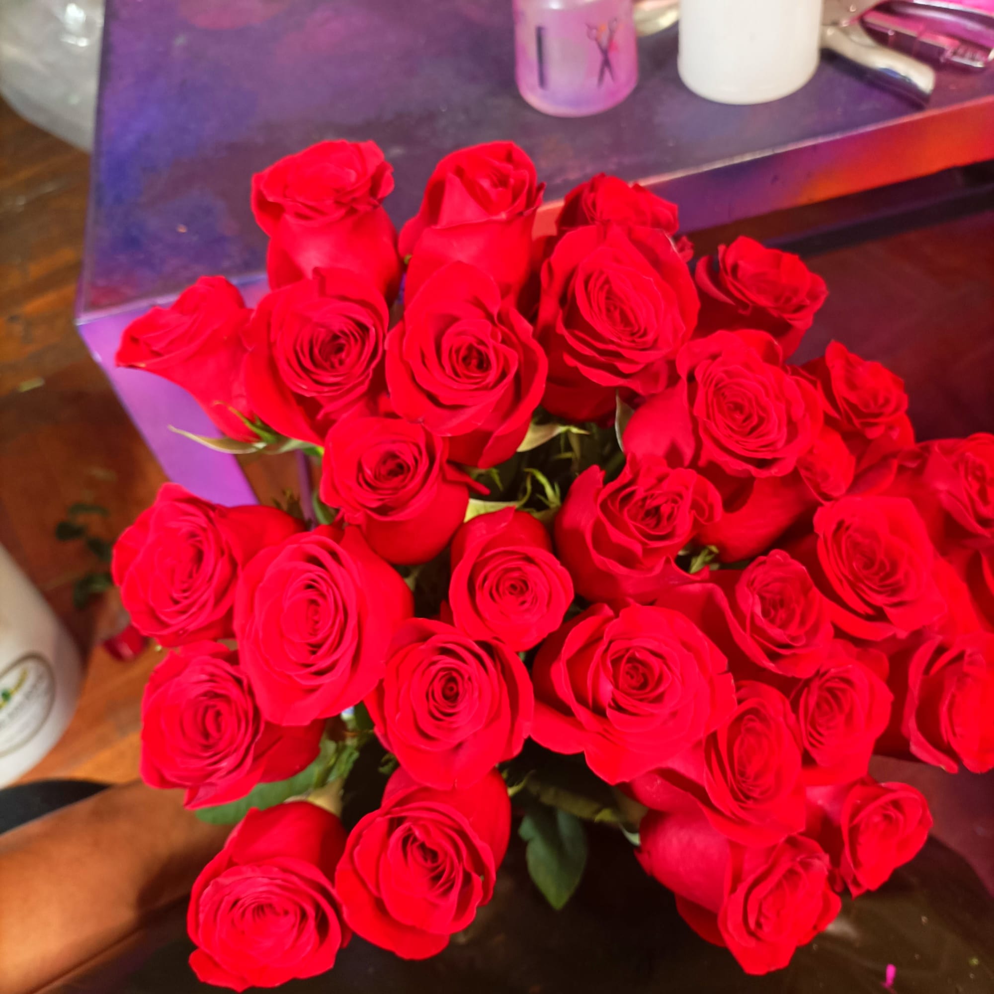 Bouquet of red roses held in hand