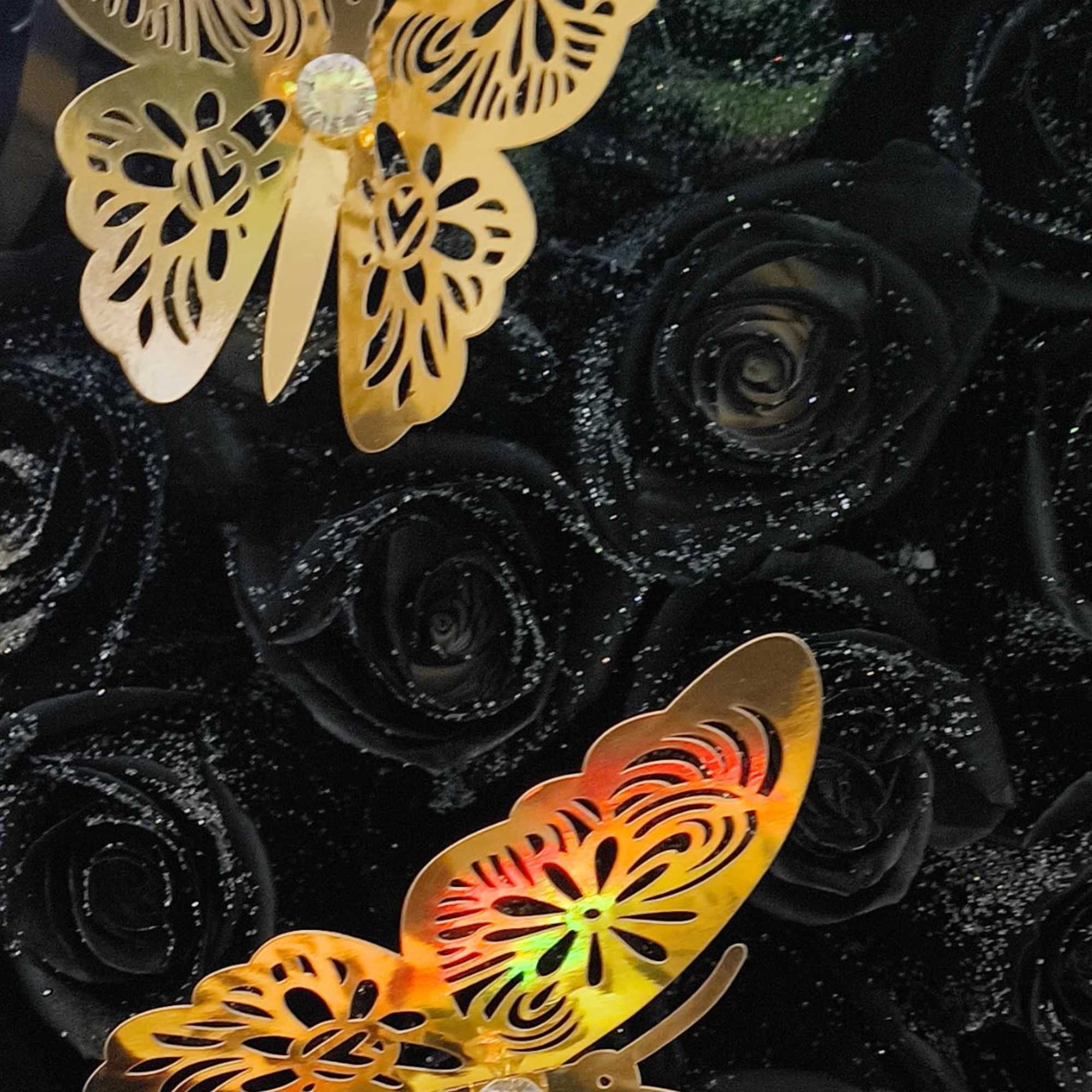 Black rose bouquet with two gold butterfly decorations