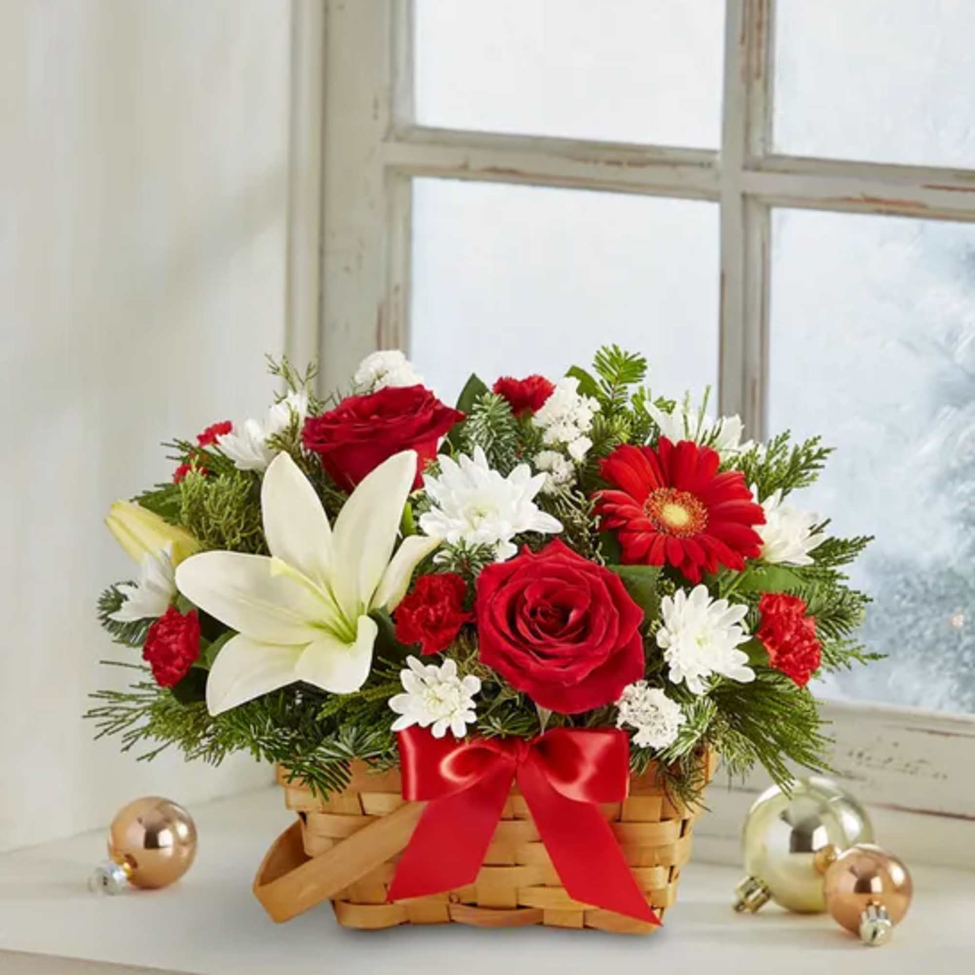 Spread holiday cheer with our basket of blooms. Capturing the natural beauty