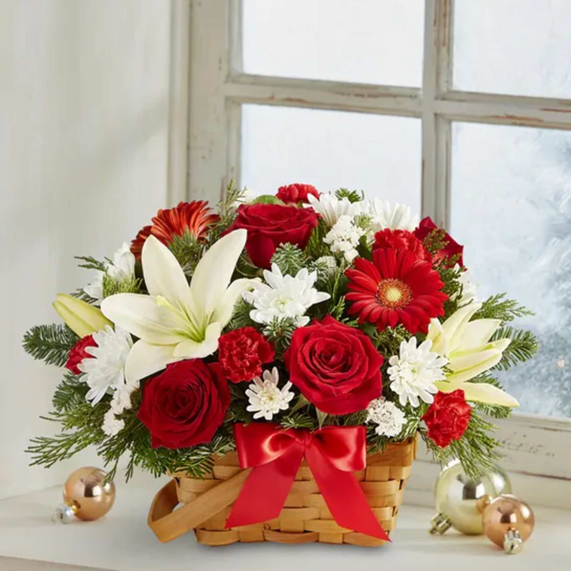 Spread holiday cheer with our basket of blooms. Capturing the natural beauty