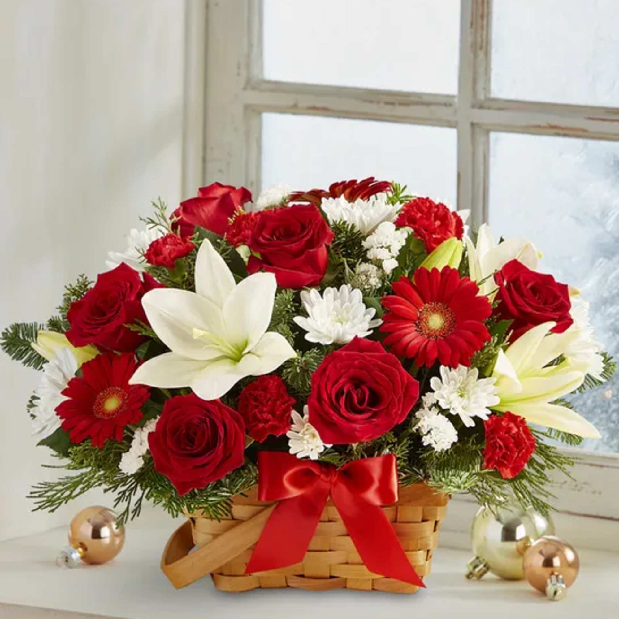 Spread holiday cheer with our basket of blooms. Capturing the natural beauty