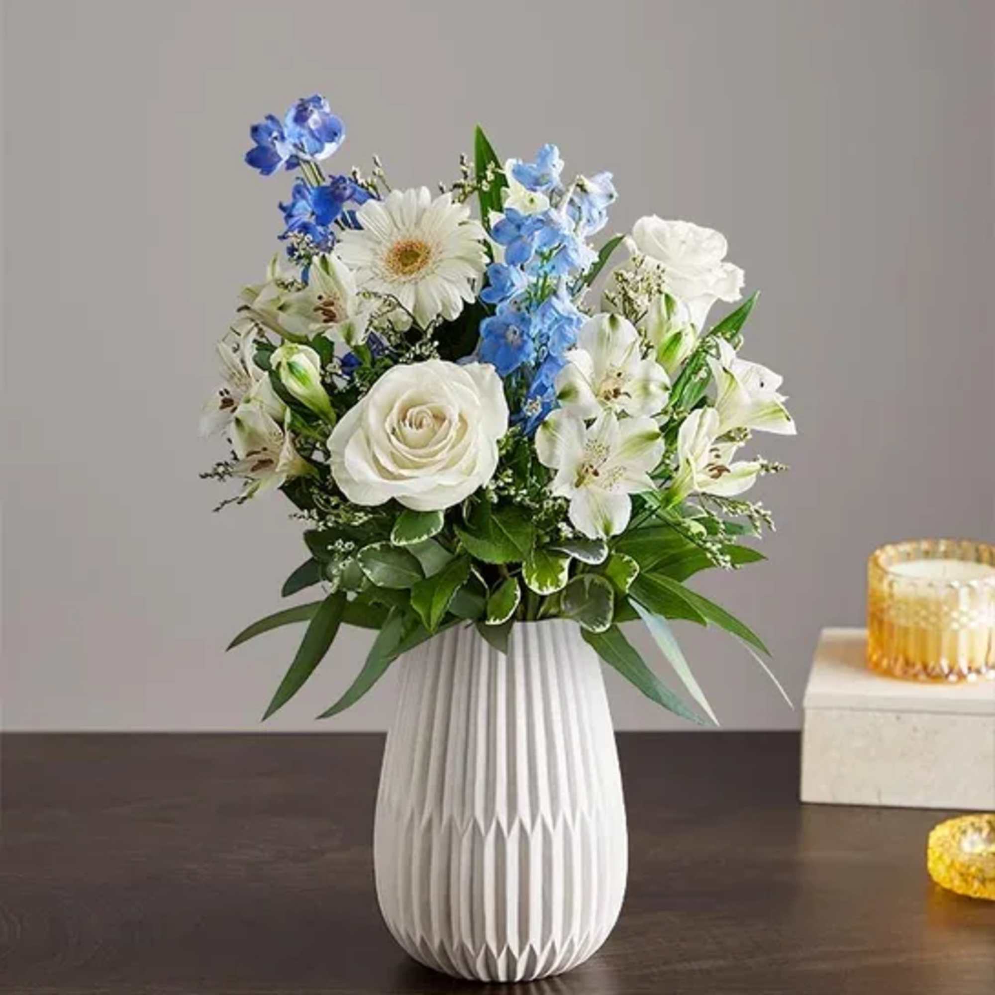 Hand designed by our florists, this elegant gathering features soothing blue and